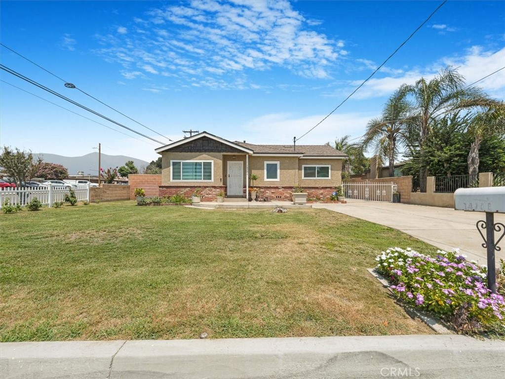 Welcome to 14708 Valencia Ave, a rare gem in an established Fontana neighborhood! This fully renovated 3-bed, 2-bath home blends charm and modern upgrades throughout. There is a 4th bedroom plus office space that is great for homework or work-from-home. Enjoy handcrafted Spanish tile flooring imported from Mexico, upgraded electrical outlets, and 22 new dual-pane, energy-efficient windows. The bathroom features a Bluetooth light and relaxing rain shower, while taller baseboards, wood beams, and an open floor plan create a warm, modern feel. The expanded kitchen includes a pantry and a flush-mounted refrigerator for a sleek finish. The primary suite offers dual closets and dimmable lighting. Outside, the long driveway provides RV parking, and the garage includes new windows, electrical, and a full bathroom—perfect for an ADU conversion. The home also features an energy-efficient water tank, automated sprinkler and drip line system, and a large metal storage shed. The interior has been double-sealed for enhanced pest protection. Move-in ready and built to impress!