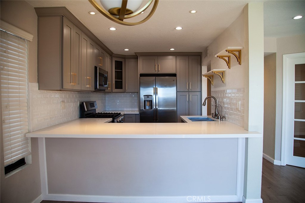 This unit is truly a standout—checking every box tenants look for. A bright and spacious 2-bedroom, 2-bathroom condo featuring an updated kitchen, in-unit washer and dryer, dishwasher, and two assigned parking spaces. The living room is filled with natural light and opens to a balcony with incredible mountain views, making it perfect for anyone who thrives on sunshine.
The primary suite offers a bathroom with dual sinks and a beautifully updated shower, while the second bedroom can easily be used as a home office or guest room. The building features a secure gated entrance with a call box, along with a gated pool and spa for added relaxation and convenience.