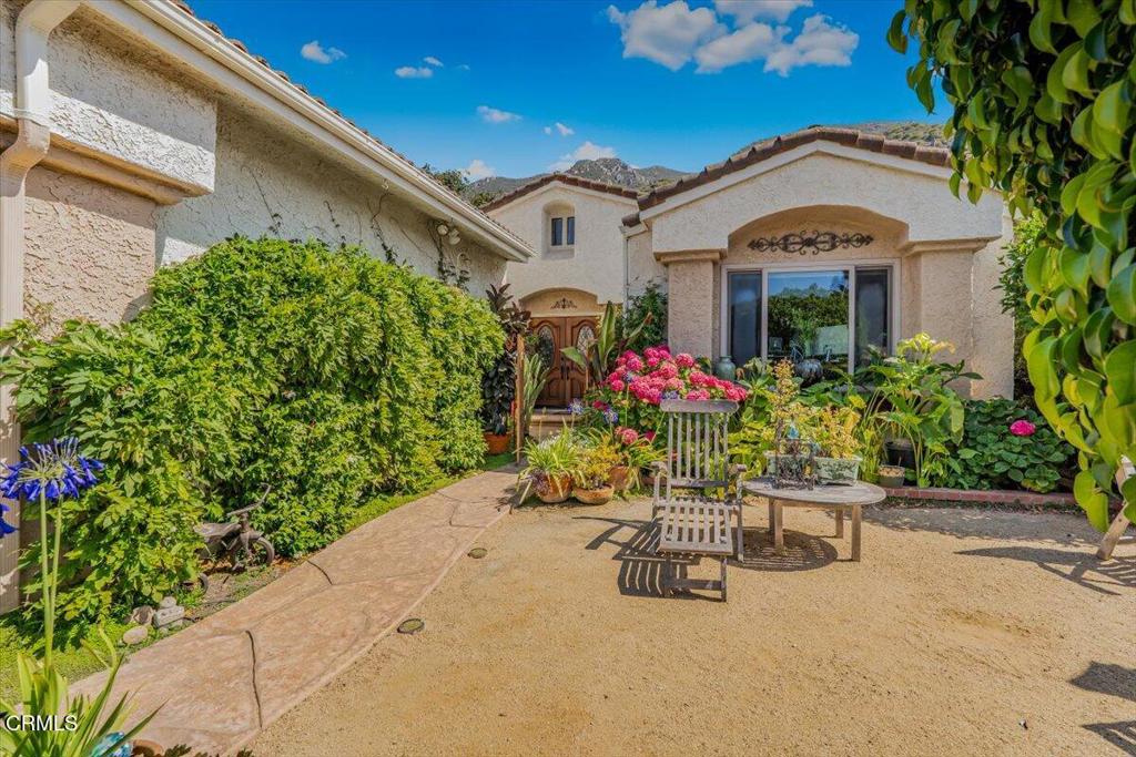 Welcome to this beautifully updated single-story home located in the highly sought-after 55+ community of The Springs. Enjoy peaceful mountain views as you enter this charming ranch-style residence, thoughtfully upgraded for comfort and convenience. Step inside to discover soaring vaulted ceilings and a bright, open-concept layout that creates a warm and inviting atmosphere.The heart of the home is the stunning kitchen--completely remodeled with an oversized island, deep drawers for easy access, and a full-height appliance pantry with pull-out shelves. Elegant, full-sized glazed pantry cabinets provide ample storage for both food and dishes, making this kitchen a dream for entertainers and home chefs alike.The expanded primary bathroom features a spacious shower and beautifully upgraded dual vessel sink cabinets, offering both style and function. The guest bathroom adds a touch of charm with a reimagined antique dresser vanity, complete with a vessel sink and antique mirror.Step outside to a unique backyard retreat, where a raised deck and rolled aluminum adjustable patio cover provide weather-proof outdoor living all year round. The beautifully maintained garden blooms from early spring to fall and includes a mature lemon tree--perfect for gardening enthusiasts or anyone who enjoys a tranquil outdoor setting.This move-in ready home offers low-maintenance living in a vibrant community and is just waiting for its next proud owner.Broker and agents do not guarantee the accuracy of square footage, lot size, or any information concerning the condition or features of the property provided by the seller or obtained from public records. Buyer is advised to independently verify all information through personal inspection and with appropriate professionals to their satisfaction.