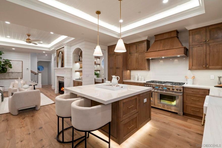 Brand New Construction Coastal Masterpiece in La Jolla’s Prestigious Beach Barber Tract – Steps to Windansea Beach & La Jolla Village.  Introducing 464 Westbourne Street – a newly constructed luxury detached home that embodies the essence of Southern California coastal living. Ideally located in La Jolla, this stunning 5-bedroom, 3.5-bathroom home offers 3,810 square feet of thoughtfully designed living space, perfectly blending timeless elegance with modern sophistication & technology. From the moment you enter, you’re greeted by soaring ceilings, exquisite crown molding, Lutron Lighting and rich custom tongue-and-groove millwork. An open-concept layout flows seamlessly through living spaces, anchored by a chef-caliber Thermador kitchen outfitted with custom alder cabinetry, a 48” commercial-grade range/Hood, built-in paneled refrigerator, farmhouse sink, natural stone counters, and a separate walk-in prep pantry with additional sink & dishwasher.  Designed for effortless indoor-outdoor coastal entertaining, the main living area opens to a stunning California Room featuring a white-washed brick facade, built-in fireplace, BBQ, TV Niche OR slip upstairs to a panoramic Roof Top Deck for year-round ocean view sunsets!  Pride of ownership & attention to detail is a common theme throughout this La Jolla New Construction Beach House, built for the luxury "lock & leave" buyer looking for their coastal lifestyle.  KITCHEN/LIVING: The 1st floor greets you w/ custom barrel roof entry, wood detailed foyer, oak engineered wood flooring + entertaining kitchen equipped with walk-in pantry w/ separate sink + 2nd dishwasher.  Sliding doors spill out onto a whitewashed brick Covered California Room w/ gas fireplace, TV niche & BBQ for indoor-outdoor entertaining. Interiors are lined with custom wood millwork & tambour detail accents Plus the Chef's Kitchen boasts modern Alder Wood Cabinetry, Spacious center island, Thermador Appliances w/ Built-in 36" Paneled French Door Fridge, 48" 6-burner Commercial Range w/ griddle, 30”Oven, Kohler Farmhouse Sink & natural slab counters, Plus a separate walk-in prep pantry with sink, microwave & separate dishwasher. LOWER LUXURY LEVEL: Slide on downstairs, to your Media/Game Room Bar w/ Speakers, Crown detail Lighting, pre-wiring, built-in media center & entertaining wet-bar w/ prep sink, 18” Thermador wine column for ~50+ bottles, floating shelves & beverage fridge + 3 additional guest bedrooms, storage room & impressive Walk-In Laundry Room. TOP FLOOR: An impressive Primary Suite w/ customizable walk-in closet spill into a spa-like master bathroom ‘wet room’ w/ floor-to-ceiling tiled walls, detached freestanding Kohler soaking tub with stone slab walls & tub light fixture, dual vanity Kohler sinks/fixtures, LED mirrors & Rainfall Shower w/ 3 function fixture. OTHER: 1 ) Walk-In Laundry room w/ Front load Washer/Dryer, farm sink + quartz counters/cabinetry 2) Solar Panels w/ Tesla Powerwall Battery 3) 2 Car Garage + EV charger outlet.  4) Exterior Beach Shower 5) ‘Control 4 Custom Home Tech’ Smart Home Wiring Builder Package w/ built-in speakers, Lutron lighting, security cameras. This New La Jolla New Construction is in a Class of its Own + live the SoCal Dream of Coastal Walkability from this low maintenance life of luxury!