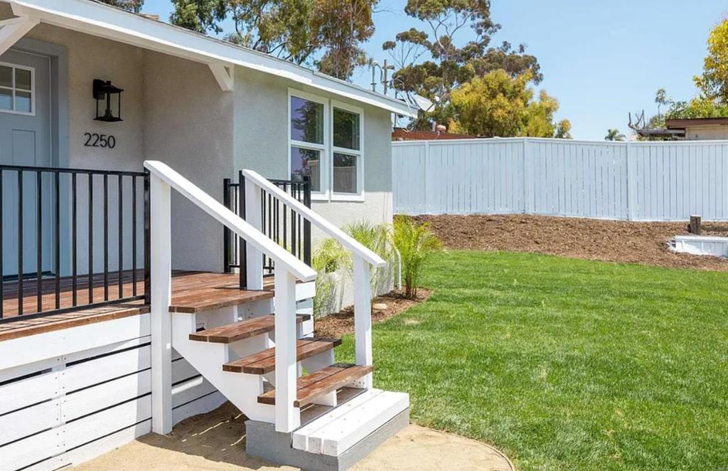 Completely remodeled 3bd/2ba Oceanside home just a few minutes from the beach. Situated on a 1/3 of an acre, this spacious lot offers a wrap around fenced yard surrounded by a wall of lush hedges, maintaining the home's privacy and also offers the opportunity to add a 500-700 sq. ft. ADU. Everything from the inside out is new with exterior and interior paint, new flooring, new mini splits with AC and heating functions, ceiling fans and stylish lighting fixtures. The kitchen is new with sleek waterfall countertops, new kitchen cabinets, all new appliances and a new laundry room and hallway storage cabinets. The exterior has new grass and landscaping and a front deck upon entry. Incredible Opportunity - don't miss this one!