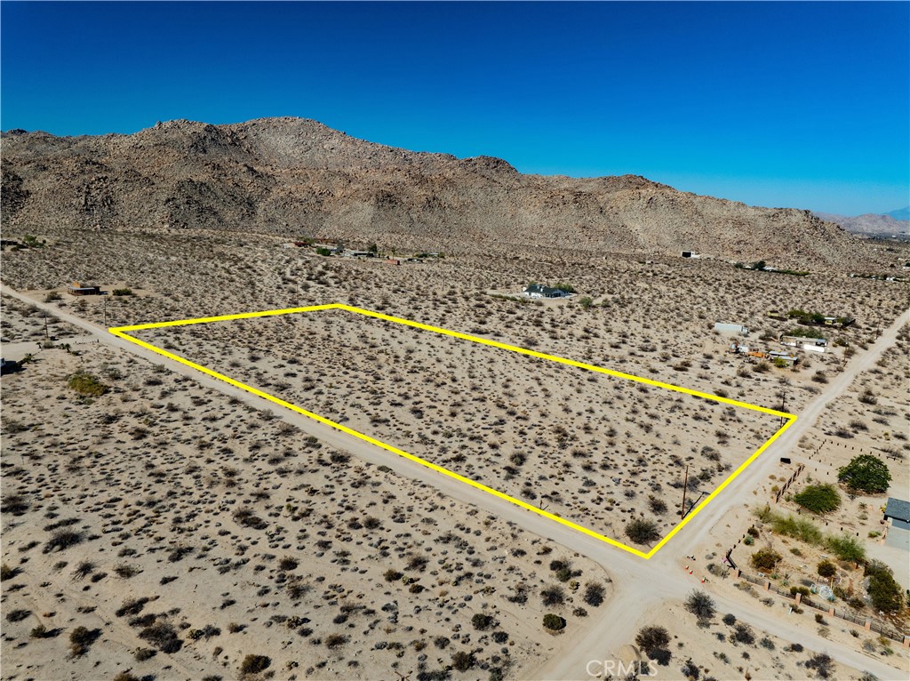 opportunity awaits you with this stunning 5-acre corner lot, ideally situated in a desirable location with breathtaking mountain views. This expansive parcel offers the perfect canvas for your dream home or investment property. Whether you’re seeking a peaceful retreat or a place to build your future, this lot provides endless possibilities. Generous size, offering plenty of space for development, outdoor fun, and privacy. Enjoy access from two roads, providing convenient entry points and maximizing design flexibility. Experience stunning views of the surrounding mountains — the perfect backdrop for any property. Situated in a prime area known for its tranquility, natural beauty, and proximity to all the local amenities that 29 Palms has to offer.
It is the buyer’s sole responsibility to verify access to utilities (including water and power), zoning designations, and applicable county or city building requirements. Buyers are advised to perform thorough due diligence and consult with appropriate licensed professionals to ensure the property meets their needs and intended use. Property address is fictitious and provided for listing purposes only.