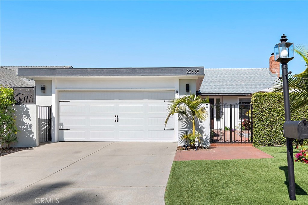 Tucked away in the tranquil Laguna Terrace neighborhood, 22665 Ancona is a thoughtfully updated 3-bedroom, 2-bathroom single-level home that perfectly captures the essence of Southern California indoor-outdoor living. While the home spans 1,120 square feet, it lives like 3,000 thanks to a brilliantly designed open floor plan and a seamless transition between interior spaces and the expansive outdoor setting, taking full advantage of the generous lot.
Inside, the upgraded kitchen features custom cabinetry, Tuscany cream stone countertops, stainless steel appliances, and flows effortlessly into a bright, open living area with a stacked stone fireplace, crown molding, and recessed lighting. Oversized sliding doors extend the living space into a backyard oasis that feels like a boutique resort, complete with a private in-ground pool, swaying palm trees, and low-maintenance landscaping that make entertaining or relaxing feel like a getaway.
Both bathrooms have been tastefully remodeled with travertine showers and stone surfaces, underscoring the home’s attention to detail and quality. Recent upgrades include a new electrical panel, new roof, fresh interior and exterior paint, new appliances, and a smart home system with app-controlled lighting and thermostat. The home also features a roof-mounted whole-house fan, dual-pane windows, and a newer HVAC system for maximum energy efficiency and comfort.
Located on a quiet cul-de-sac just steps from San Remo Park and only minutes from top-rated schools, dining, and shopping, 22665 Ancona delivers an exceptional blend of comfort, sophistication, and the elevated indoor-outdoor lifestyle that defines life in Laguna Hills.