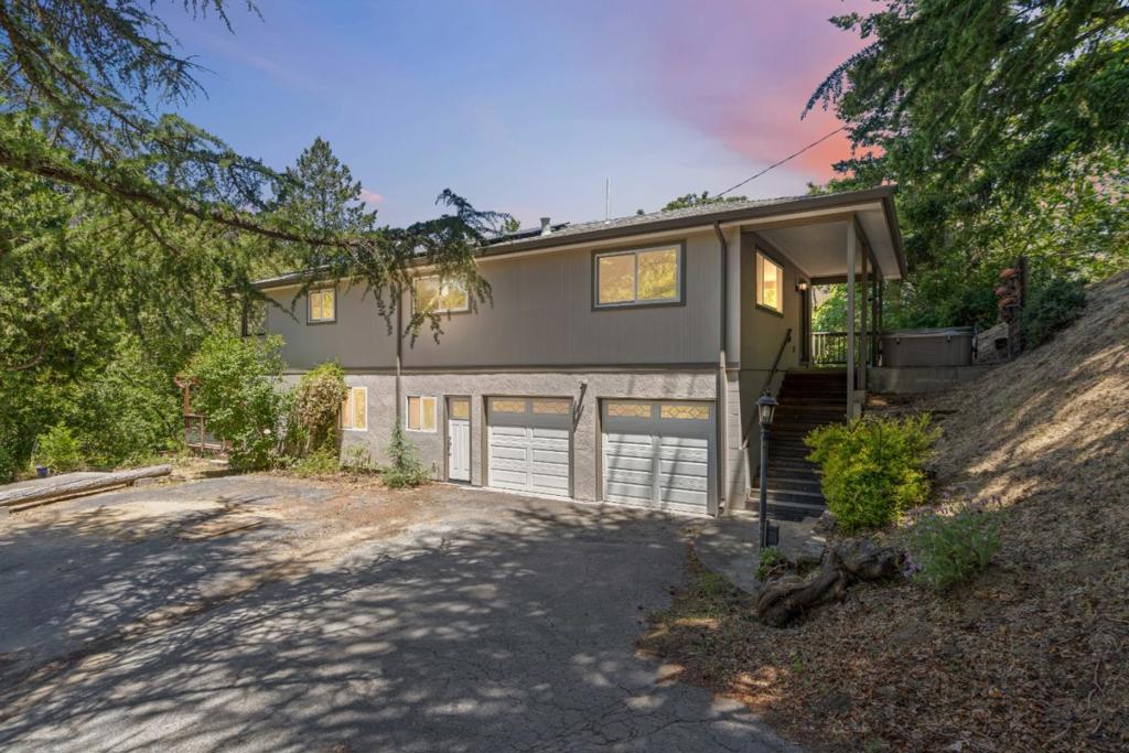 Located just minutes from crowd favorite The Summit Store, this updated 4 bed/2 bath home features newly installed LVP flooring, renovated bathrooms, and updated kitchen cabinets and countertops. The living room is filled with beautiful natural light thanks to numerous oversized windows that help bring the outside in. Energy efficiency is a plus with fully paid-off solar, adding long-term value and reducing monthly utility costs. Perfect for someone looking to offset their mortgage with the option to rent out the lower portion of the home, or use it for long-term guests or multigenerational living. Enjoy easy access to downtown Soquel and Capitola, as well as scenic San Jose Soquel Rd and Highway 17 for Silicon Valley commuters. World-class hiking and mountain biking trails are right at your fingertips. Come experience the best in Santa Cruz Mountain living.