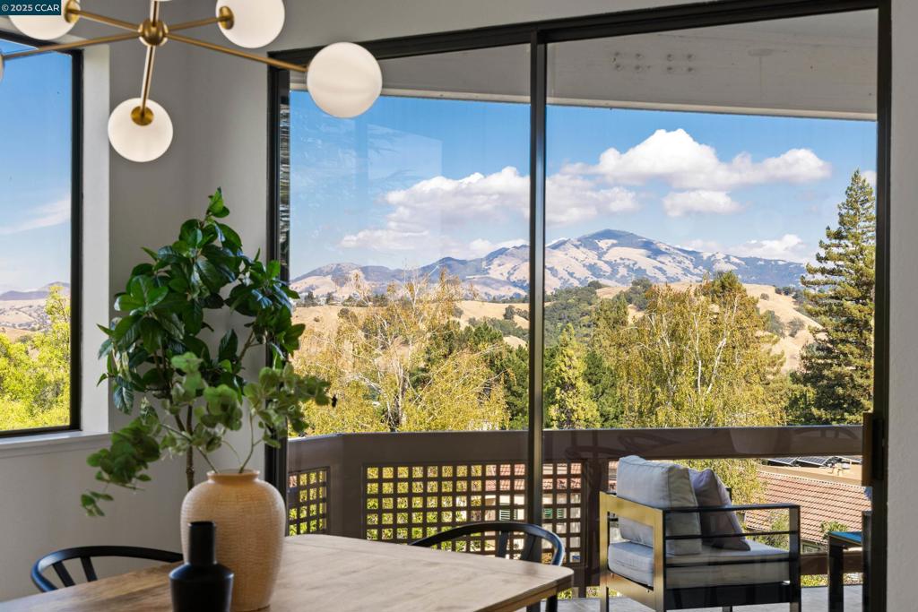Rare Opportunity to own this beautifully remodeled Villa Robles with panoramic views of Mount Diablo, the valley and golf course - views appreciated from the kitchen, dining room, living room, primary bedroom, and large balcony. Don’t miss this rare chance to own one of Rossmoor’s most beautiful homes expertly transformed with new carpet, paint, fixtures, and cabinet faces. This stunning 2-bedroom, 2-bath blends timeless elegance with modern sophistication and abundant natural light. This home includes a rare, attached garage and large storage loft with a pull-down ladder. The serene primary suite boasts a private patio, perfect for morning coffee. Additional highlights includes dedicated laundry with washer/dryer, and the homes location which is in a pastoral setting, adjacent to oak studded hills at the top of Ptarmigan Drive, on a cul-de-sac.