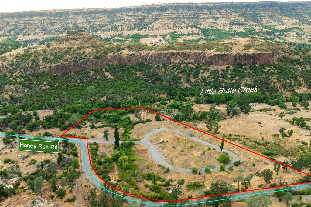 Position your next project in a setting that blends natural beauty, accessibility, and long-term value. This is a rare opportunity to own 9.6 acres in one of Butte County’s most sought-after locations. Ideally situated near the iconic Honey Run Covered Bridge, the property offers convenient access to both Paradise and Chico. The land supports a wide range of possibilities—from a custom home or private retreat to an investment or development project. Enjoy access to Butte Creek, along with sweeping views of the surrounding canyon and bluffs. With a setting that offers privacy, natural appeal, and strategic location, this property is truly one of a kind.