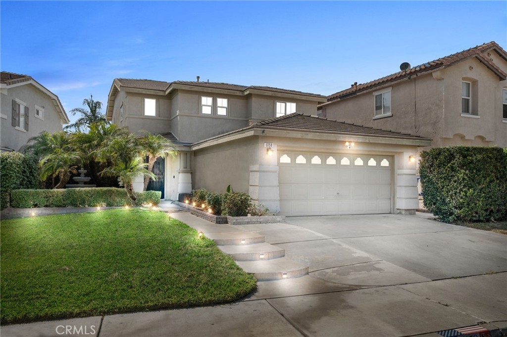 Looking for a beautiful home in the sought after community of Sierra Lakes? You will love this spacious two-story home with 2,138 square feet of space, 3 bedrooms, 2.5 bathrooms and a spacious loft! Enjoy this open floor plan, perfect for entertaining guests or relaxing in style at home. The formal living and dining room offers plenty of wall space for artwork and a large mirror. In the oversized family room, you have a media niche with a wide display area for fun holiday décor. The family room is open to the breakfast area and kitchen with stainless steel appliances, ample cabinetry storage and a door to the side yard. The loft features a free-standing electric fireplace cabinet for efficient, cost-effective heating. Need flexible space? Use the loft as your game room, study – or convert it into a 4th bedroom. Relax in the primary suite with a rustic-style sliding barn door that opens to the ensuite bathroom. Enjoy the soaking tub, separate shower, double sinks, privacy toilet door and walk-in closet. A secondary bedroom has a walk-in closet with a window; all bedrooms have a ceiling fan. The indoor laundry room has cabinet space, and the AC was replaced about two years ago. This backyard is ready for BBQs with a covered concrete patio, block walls and lawn. There is also a storage shed at the side yard for garden gadgets. You will love this North Fontana home with no HOA dues! We are convenient to Victoria Gardens, Sierra Lake Golf Course, shops, schools, restaurants, the 210 Freeway and much more!