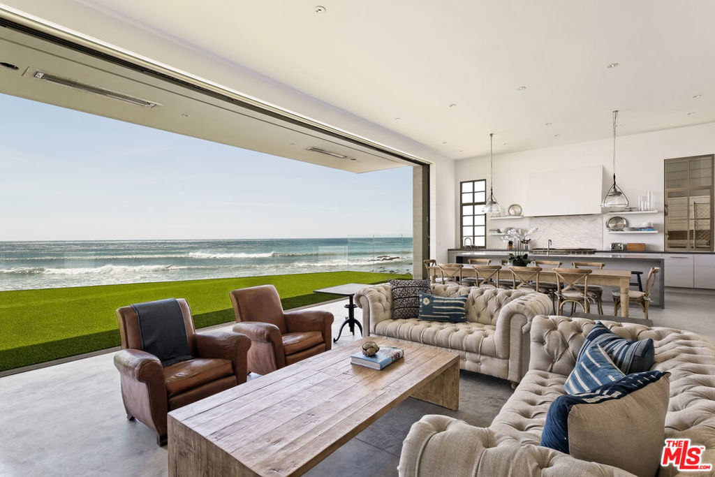 Stunning beach home on the world-famous Malibu Colony Beach. Wide lot with 66ft of beach frontage and surfing point break located directly out back. Sophisticated design by renowned architect Steve Giannetti, including an impressive great room with 12ft tall by 36ft wide walls of glass that disappear and open up to one of the largest and most dramatic beachfront decks in all of Malibu. Meticulous attention to detail throughout, designed for the most discerning clientele. All 5 bedrooms are en-suite and located on the second floor, the Primary + 2 additional bedrooms are oceanfront. Ample parking cars and close proximity to Malibu's top boutiques, shops, and restaurants.