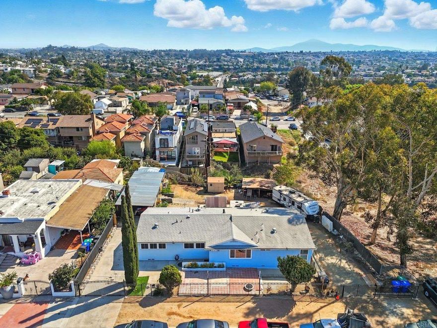 Welcome to 3015 Chamoune Avenue, San Diego, CA 92105!  Experience the space and comfort of this 5-bedroom, 4-bathroom home, perfectly suited for large families, multi-generational living, or investors seeking rental flexibility.  The thoughtful layout includes a primary master suite with its own private bath and two junior suites, each featuring individual en-suite bathrooms with modern stand-up showers. Two additional bedrooms share a full hallway bath, offering privacy and functionality for everyone.  Enjoy indoor laundry, upgraded double-pane windows in most rooms, and a newer tankless water heater for added efficiency and convenience.  Outside, the large backyard provides endless opportunities—spacious enough to add a pool or ADU, with dual RV access on both sides of the property for extra parking and versatility.  Located in the central City Heights neighborhood, this home offers close proximity to parks, schools, shopping, and major freeways. With its generous layout, upgrades, and strong investment potential, 3015 Chamoune Avenue delivers a rare blend of comfort, opportunity, and value in the heart of San Diego.  Don’t miss your chance to make this home yours!