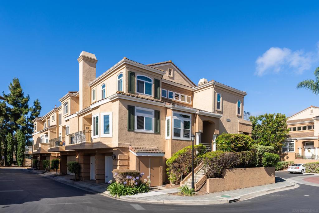 Pride of ownership defines this extensively remodeled end-unit townhome in the highly desired Renaissance/Avanti community. With 3 bedrooms, 3 baths and approx. 1,720 sq ft, this residence offers privacy, natural light, canyon breezes, and sunset views. The home showcases hardwood flooring, marble entryway, crown molding, recessed lighting, dual-pane windows and sliders with energy and sound packages. The gourmet kitchen was redesigned with quartz countertops and backsplash, a large custom island with built-in storage, farmhouse sink, stainless appliances, and built-in lighting. A separate bar area features quartz countertop, dual-tap kegerator, beer fridge, wine rack, and liquor cabinet, perfect for entertaining. All bathrooms have been remodeled with high-end finishes. The luxurious primary suite includes an oversized Carrera marble shower with multiple heads and bench, soaking tub, and dual sinks with Carrera countertop. Guest bath also features Carrera marble. Additional highlights include mirrored closet doors, 50-gallon water heater, Wi-Fi enabled high-efficiency HVAC with new ductwork, and gas fireplace with marble hearth and media access. Conveniences include upstairs laundry, hallway storage, and attached 2-car garage with built-ins, workbench, and extra storage. Community amenities include pool, spa, landscaped grounds, fountains, 24-hr security, and HOA coverage of water, sewer, trash, and landscaping. Close to UTC Mall, Nobel Fields, dog park, library, transit, and greenbelt trails.