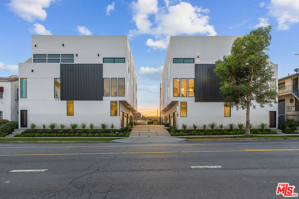 Discover The Ten at Rampart, a rare Small Lot Ordinance home in the heart of Historic Filipino town, one of Los Angeles' most vibrant and centrally located neighborhoods. This modern 3-bedroom, 3.5-bathroom residence offers over 2,000 sq. ft. of light-filled living space, designed with open-concept flow and sleek finishes throughout. The chef's kitchen is equipped with quartz countertops, custom cabinetry, and premium stainless-steel appliances, opening to expansive living and dining areas ideal for both entertaining and everyday comfort. Floor-to-ceiling windows bring in abundant natural light, while the private rooftop deck showcases sweeping views of the Downtown Los Angeles skyline, perfect for evening gatherings and enjoying iconic city sunsets. The spacious bedrooms include a luxurious primary suite with spa-inspired bath, while the attached garage provides convenience and secure parking. Blending modern architecture with an unbeatable location, The Ten at Rampart places you minutes from Echo Park, Silver Lake, Koreatown, and DTLA, with access to top dining, shopping, and cultural destinations. This is a rare opportunity to own a contemporary Los Angeles home with skyline views, rooftop lifestyle, and incredible city access in a thriving neighborhood.
