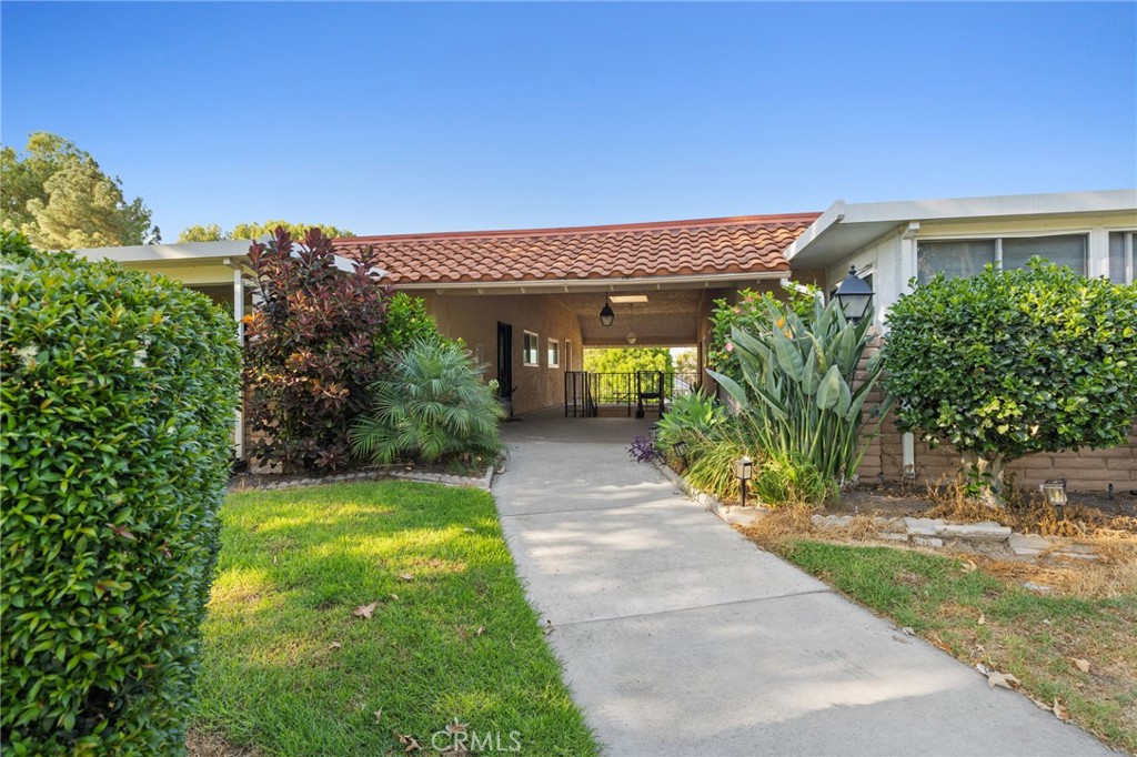 This Casa Vista Stunner has been tastefully remodeled to modern expectations with an open floor plan featuring multiple skylights in kitchen, dining and living room with fantastic privacy in the rear balcony. Enjoy warm summer evenings and cool ocean breezes from your balcony which offers some views of the surrounding hills and treetops. This home is also equipped with an HVAC system to keep you cool in the summertime and warm during chilly winter months. No expense has been spared with new windows, sliders, LVP flooring, recessed lighting, remodeled kitchen and bathrooms as well as custom blinds for the bedrooms. A spacious walk-in-pantry closet has been added for convenience. Living room features a unique Slat styled wall with cable hookups ready to go, along with custom end cabinets and lighting on both sides with a new electric fireplace below. Master Bedroom is spacious and features direct access to the beautiful master bathroom suite and walk in closet. Both bathrooms have been completely remodeled into modern styled bathrooms featuring frameless glass shower doors, porcelain tiles, shaker cabinets, new sinks, faucets, quartz countertops, vanity lights, and mirrors. NO STAIRS OR STEPS from assigned carport nearby to front door. New solid wood front door with window for additional lighting and conveniently located walking distance to clubhouse 6 and just down the street from Gate 10 entrance. Come enjoy the incredible amenities Laguna Woods has to offer those seeking an Active living style or retirement with the security of a Gated Community. This street has really beautiful views of the surrounding hills, making it great for long walks. A very quiet part of Laguna Woods nestled in the corner of the community with not a lot of traffic. Laguna Woods Village is a Golfers Haven featuring 27-holes of championship golf. Residents are allowed to drive within the community in their golf carts as well. Other amenities include: 24-hour gated community with attendant, bus transportation, Equestrian center, 10-tennis court complex, pickle ball courts, Laguna Woods Village is close to beaches, shopping, restaurants, freeways, toll-roads, and medical facilities. Your monthly HOA includes water, trash, basic cable, landscaping, insurance and exterior building maintenance. Located only 6-7 miles from world class Laguna Beach and a couple miles from the fabulous Irvine Spectrum, this home and community are truly a special place to live!!