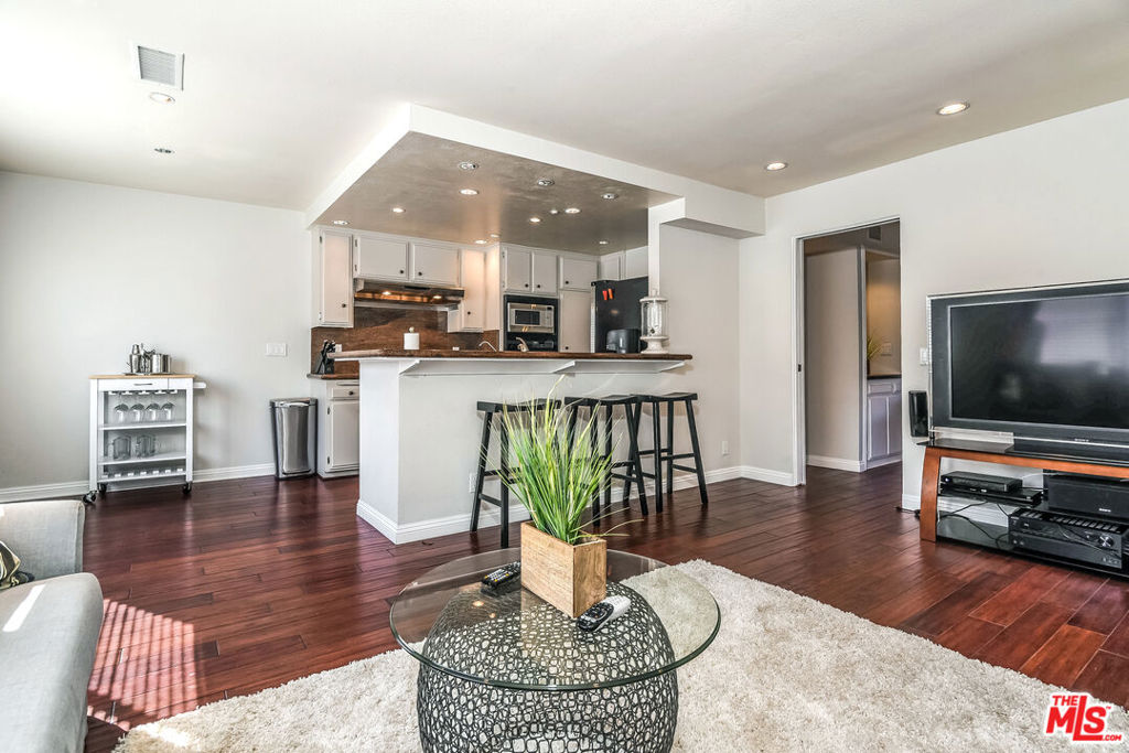 Bike ride to the beach, this spacious, updated townhome provides a quiet retreat just a short distance from everything this flourishing area has to offer: shopping, dining, cinemas, grocery stores, a park (Friday Farmer's Market across the street)! 2.5 level townhome features 2 en-suite bedrooms & downstairs 1/2 bath convenient for guests. Enter the townhouse's large, private patio which leads indoors to the open-concept living. Up a half flight of stairs, enter the open dining which leads to the updated kitchen w/ beautiful granite countertops & adjoining great room. The top floor offers two large en-suite bedrooms w/ custom built-ins. The master features a gorgeous private bath with jetted soaker tub, as well as a private, large second-story balcony. Complex offers walking paths and retreat style pool. Townhouse can be available as a furnished lease as well.