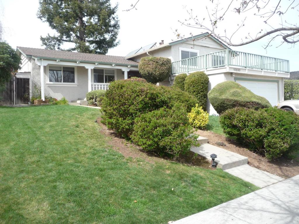 Decent and quiet neighborhood, much sought-after area, close to the best Monta Vista High, just a block away. Bright and airy, tri-level layout. Spacious 4BR/3BA (3 BR U/S, 1 BR D/S), 2102 SF living area, with large 8023 SF Lot. Gourmet kitchen- with granite countertop, quality appliance, and view to backyard; newer roofing. All 3 Full Baths are with granite countertop, tile floor, limestone wall, vanity. Family room with carpet and built-in bookshelves. Hardwood floor throughout LR, DR, stairways and all upstairs bedrooms. Double pane windows and 3 sliding glass doors gives light and easy access to backyard. Slope up step stones lead to front porch then to new double door entry. Quality light fixtures, window shuttles; roomy balcony upstairs. Professional landscaped front and back yard; 2-car garage. Large redwood tree and sized covered deck in backyard. vegi garden beds on side yard. Best Cupertino Schools- Lincoln, Kennedy Middle and Monta Vista High. Owner pays for gardening; Refrigerator and Washer/Dryer will stay; NO pets