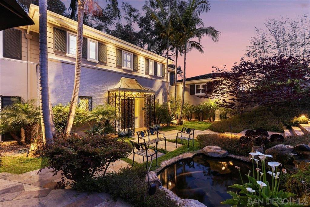 Secluded at the end of a rarely traveled dead-end street, this 3-story, 6BD/6BA with 2 optional large rooms in Loma Portal offers approximately 5,200 SF of flexible living space on a 10,000 SF lot with sweeping unobstructed views of downtown San Diego and the bay. The main level features a large chef’s kitchen, formal dining room, and a spacious living room with fireplace—all with panoramic city views. Accordion doors open to a generous deck off the kitchen and dining room, seamlessly blending indoor and outdoor living. The lower level includes a full second living room, ideal for multigenerational living, guests, or a private retreat. Outdoor highlights include a built-in BBQ, fire pit, koi pond, and tranquil waterfall in the front yard. Patios off the first and third floors offer additional outdoor escapes, while the lush, oversized backyard offers endless opportunities to bring your own vision to life. With soaring ceilings throughout, 3 storage rooms, a 3-car garage, and 6 additional off-street parking spaces, this home delivers rare space, privacy, and flexibility. Properties like this—offering scale, views, and such a peaceful setting in the heart of Point Loma—are few and far between. A spectacular and rare offering!