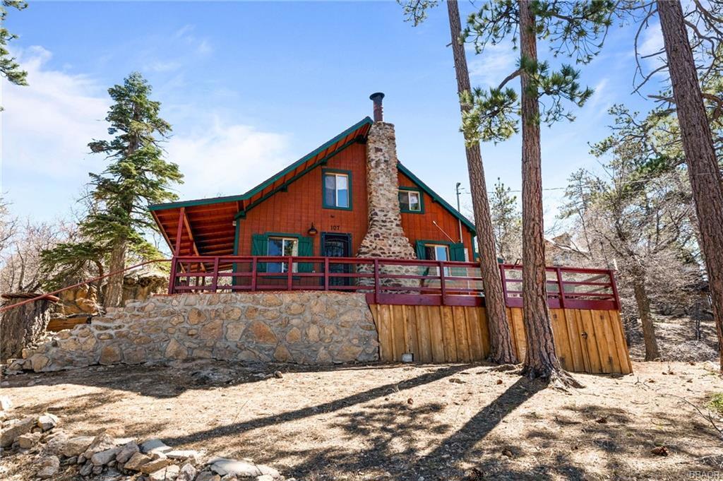 A true 'Cabin in the Woods' Nestled in the San Bernardino National Forest yet only 1 mile to the Lake and close to the Village of Big Bear Lake as well. Amazing hiking and biking out your front door including access to the Cabin 89 trail. Located on a knoll, you get a panoramic view of the forest through the trees and a partial lake view. Mill Creek is plowed during the winter so a rare Forest Lease Cabin that has year round access with level entry. The cabin has all the modern amenities (new Rinnai heater, washer, dryer, and dishwasher) yet still feels like the rustic cabin that it is with the 'wedge-wood' antique stove. Custom made King Bed with storage sits up in the full size loft. Living room and dining area are all focused on the oversized rock fireplace and open into kitchen. Previous owners replaced the roof, wrap around deck, windows and doors so all is needed is to move right in. Sunrise to Sunset - you can see them both from the inside and out on the deck of the cabin and we won't even go into details about the stargazing. Watch the 4th of July Fireworks from the driveway and don't worry about the traffic. No bank financing available and they are for Second Home use only. No Short-term rentals allowed.
