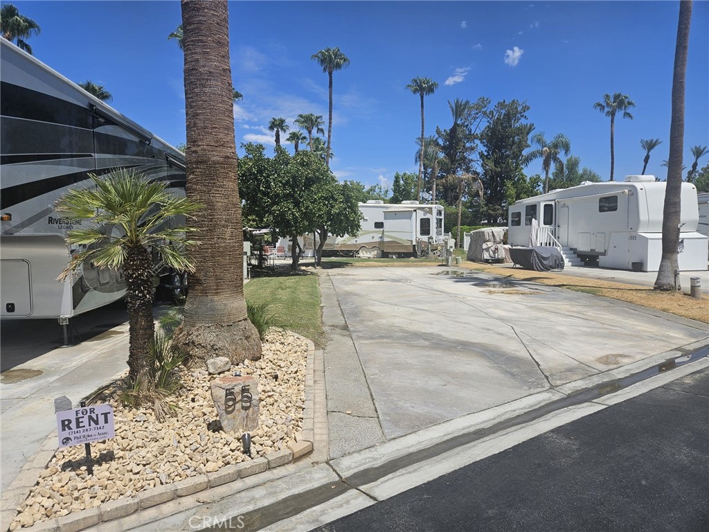 This spacious RV Lot #55 is 2,178 SQ ft includes new landscaping,rocks in flowers beds, 2 new palm trees, lot number sign and is located in the center of the action at the Luxurious Outdoor Resort Palm Springs RV Resort & Country Club!
Outdoor Resort Palm Springs Country Club is a luxury RV Resort situated on 137 beautifully landscaped acres with 2 executive Golf Courses, 8 swimming pools, pickleball and tennis courts, La Roma Restaurant, 19th Hole Bar, Owners Lounge, Lupe's Beauty Salon, Ownership Lounge and more.
Close to Satellite A, Golf Course, La Roma Restaurant, La Palma club house, pool, gym and tennis courts. LOT ONLY for sale