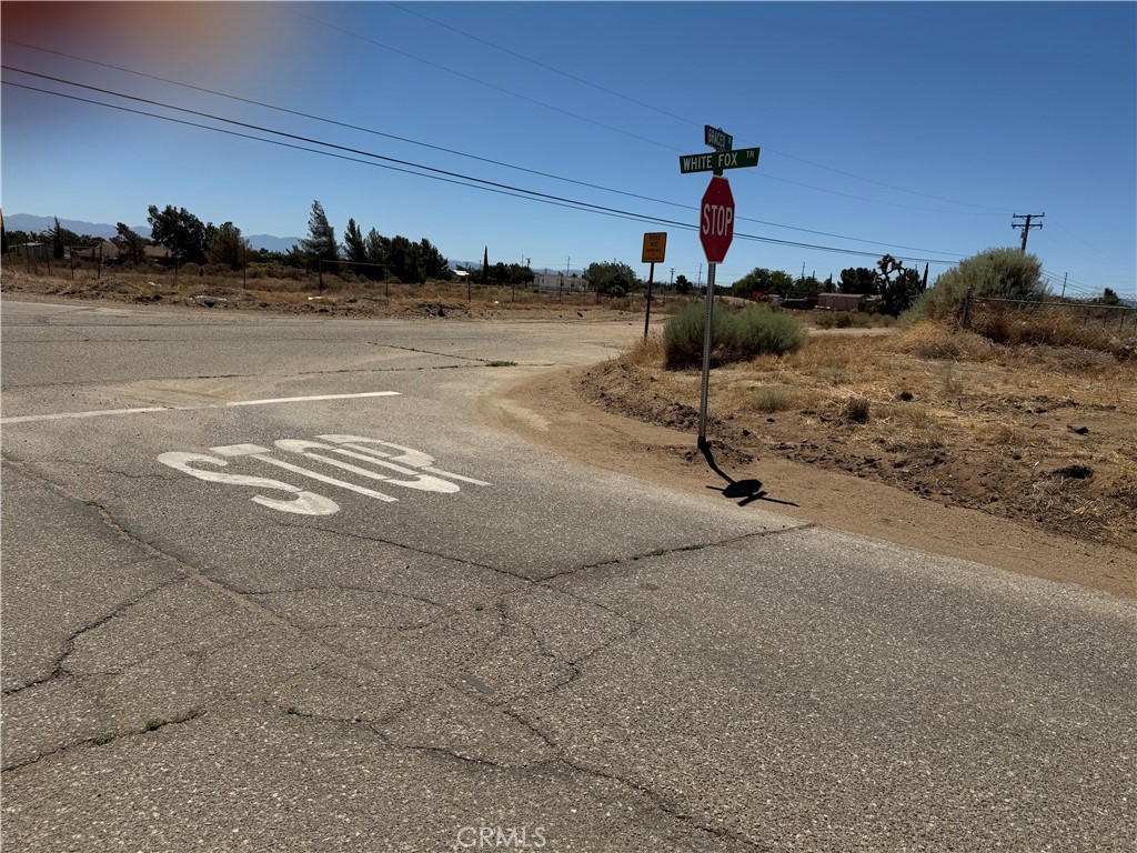Oak Hills corner lot has WATER METER, Natural Gas and electricity on the street, Corner to paved White Fox Trail, all fenced close Baldy Mesa rd., and Phelan Rd