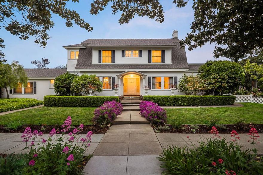 Nestled in the heart of Old Palo Alto, this beautiful home showcases the elegance of early 20th-century architecture blended seamlessly with modern updates. Originally constructed in 1915, this home stands as a rare and refined example of classic design in one of Silicon Valley's most desirable neighborhoods.   The main house features 3 BR and 2 BA upstairs, with a 1/2 BA on the ground floor. A separate den/guest room with a full BA provides a versatile space for guests or home office. Enjoy the sunlit library, lined with built-in bookcases and large windows overlooking the backyard. Hardwood floors throughout the main areas. Formal DR w/ a Venetian chandelier and built-in china cabinets.  Boasting one of the largest lots in the area, this elegant home offers an expansive yard perfect for entertaining or everyday enjoyment. A safety-covered pool, hot tub, heated deck, lawn, and bocce court make it an entertainers paradise. A backyard cottage with full bath and kitchenette provides options for a guest suite, home office, or rental opportunity. Also on the property is the original carriage house, suitable for a workshop, studio, or storage.  Huge 2-car garage. New Roof & Solar. Updated bathrooms & kitchen. Close to top Palo Alto Schools, Parks, Stanford University and Hospital.