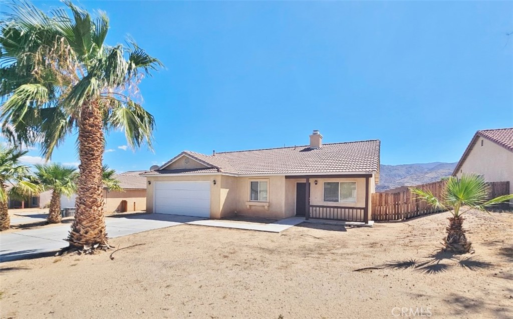 YOUR new home awaits~~! 3 bedrooms, 2 bathrooms located in one of 29 Palms' nicest neighborhoods - Desert Vista!! Spacious Living and Dining Room off the entry, Family Room with FIREPLACE, and kitchen. Kitchen has GRANITE COUNTERS, TILE FLOORING, and STAINLESS STEEL (mostly) APPLIANCES. :-) Kitchen includes access to the private backyard. Down the hall from the Kitchen you'll find a Full Bathroom with Tub/Shower Combo, two Secondary Bedrooms, and the Laundry Room with WASHER & DRYER INCLUDED WITHOUT WARRANTY. At the end of the hall is the Primary Suite with plenty of room for a king-sized bed, TWO WALK-IN CLOSETS, and Primary Bathroom with Tub/Shower Combo! PRIVATE BACKYARD ACCESS FROM THE PRIMARY SUITE!! Backyard includes Covered Patio, room for gatherings, a VIEW OF JOSHUA TREE NATIONAL PARK, and NO NEIGHBORS BEHIND! 2-CAR GARAGE. Rent includes kitchen appliances plus washer/dryer without warranty. Tenants pay for utilities and other services. No smoking anywhere on the premises. Pets / animals will be considered on a case-by-case basis. MAKE THIS YOUR HOME TODAY!!!