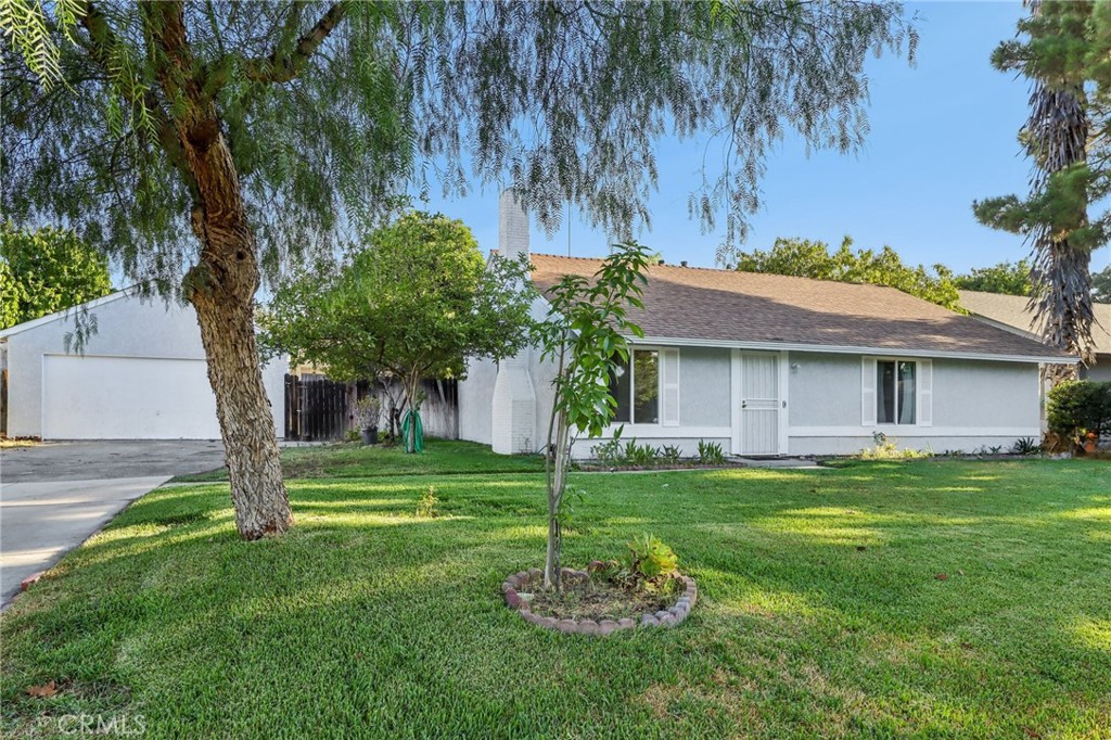 Charming single-story home! This 3 bedroom, 2 bathroom residence offers 1,240 sq. ft. of living space on a spacious 7,830 sq. ft. lot. The home features a freshly painted exterior, giving it great curb appeal. A detached converted garage without permits. Which can provide potential for additional living space. The backyard includes mature fruit trees and plenty of room to enjoy. Located in a well-established community near shopping centers, schools, and freeway access, this home is a great opportunity for those seeking comfort, convenience, and future potential.
