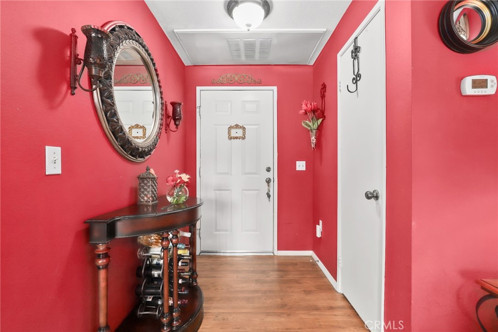 Luxury 1-Bedroom Condo in Gated Saugus Community - Beautifully updated upper-level 1 bed / 1 bath condo located in the secure and well-maintained Bordeaux community in Saugus. This charming unit features an open-concept floor plan with custom paint, elegant window treatments, and abundant natural light. The kitchen is equipped with granite countertops, white cabinetry, and matching appliances—perfect for everyday living and entertaining. Enjoy relaxing or hosting on your private balcony with serene views of the resort-style pool and lush landscaping. The spacious bedroom includes a walk-in closet and en-suite access to a full bathroom with dual sinks and ample cabinet storage. Additional highlights include in-unit laundry, newer carpet throughout, central A/C and heat, and a tandem garage located just steps from the unit. The Bordeaux community offers a resort-like atmosphere with a sparkling pool, spa, clubhouse, BBQ area, and fitness center—all included in the HOA. HOA dues cover water, trash, landscaping, and common area maintenance. The gated entrance adds an extra level of privacy and security. Conveniently located near shopping, dining, parks, and award-winning schools, with easy access to major commuter routes. Ideal for first-time homebuyers or anyone seeking low-maintenance, stylish living in one of the most sought-after neighborhoods of Saugus.