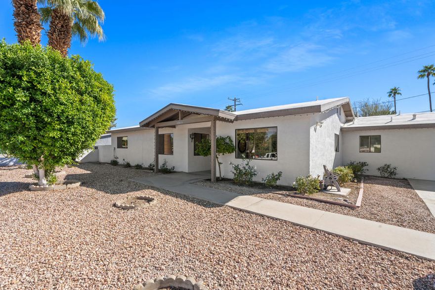 Experience the best of desert living in this inviting South Palm Desert retreat, where El Paseo's vibrant shops and restaurants are just a leisurely walk away. This immaculately-maintained 3-bedroom, 2.5-bath home with a spacious den offers the perfect balance of comfort and style. Step inside to discover 2,038 square feet of light-filled living space, where recessed lighting, tile floors, and an open, airy layout create a warm and inviting atmosphere. The spacious kitchen is a chef's delight, featuring stainless steel appliances, a gas range, and a breakfast bar--ideal for casual mornings or entertaining friends. An individual laundry room with a sink adds everyday convenience. The primary suite is your private escape, complete with a walk-in closet, dual vanities, and a tiled shower. Step outside to your own private desert oasis--a saltwater pebble tech pool and spa surrounded by a large covered patio and mountain views. Whether you're hosting a sunset dinner or enjoying a quiet morning swim, this backyard is made for relaxation and connection. With a newer roof (2022), fresh paint (2022), newer AC (2021), and updated pool equipment (2023), this home is move-in ready and designed for years of effortless enjoyment. The large driveway and two-car garage provide ample space for guests and storage. Don't miss this rare opportunity to own a beautifully maintained home in one of Palm Desert's most desirable neighborhoods--where modern living meets timeless desert beauty.