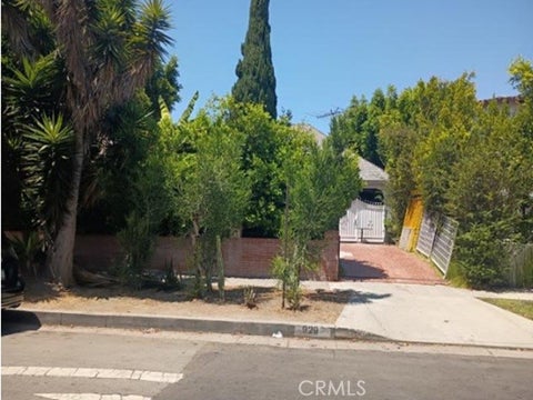 Photo of 929 S Muirfield Road, Los Angeles, CA 90019 (MLS # IV26178350)