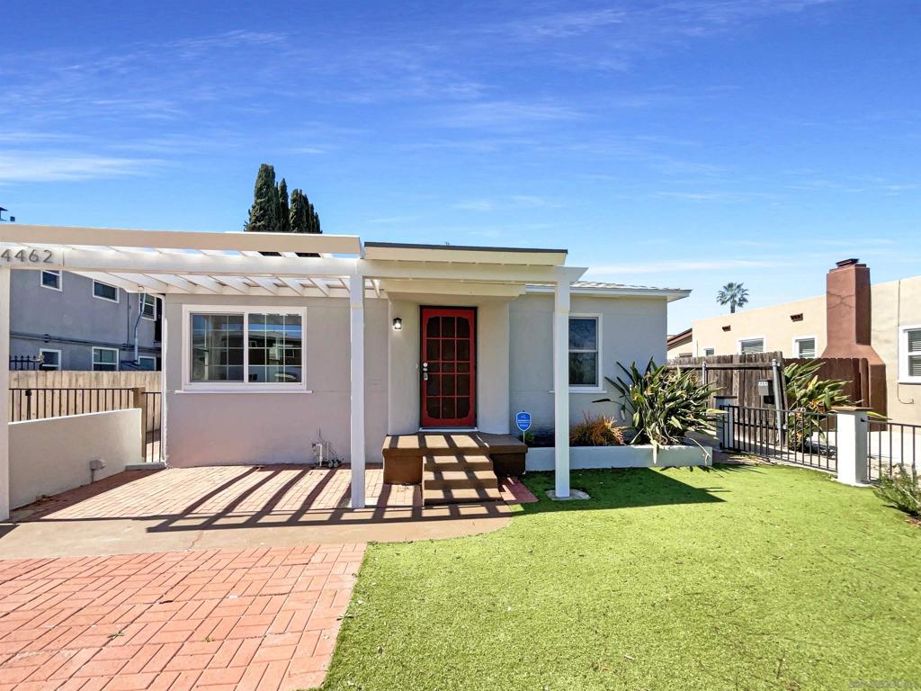 This charming Talmadge home offers great natural light throughout, creating a warm and inviting atmosphere. Freshly painted inside and out, the home feels modern and well-maintained. The kitchen features space for a cozy breakfast nook, perfect for morning meals. The spacious living room can easily accommodate a dining table and boasts a beautiful view of the inviting, fenced-in front yard, along with a charming porch—ideal for relaxing weekends. The generously sized primary bedroom, located at the back of the home, features wall-to-wall closet space and a convenient door that opens to the backyard. The middle room offers versatility, perfect for optional 3rd bedroom, an office or a TV/playroom. The second bedroom overlooks the front yard, providing a peaceful retreat. The long driveway leads to a two-car detached garage, complete with a bonus shed off the south side—perfect for hobbies or outdoor entertaining. Laundry hookups are conveniently located in the garage. The backyard offers enough room to create a lovely garden or set up a dining area for al fresco meals. With quick access to freeways, Mission Valley, SDSU, Trader Joe’s, parks, cafes, and nightlife, everything you need is just minutes away.
