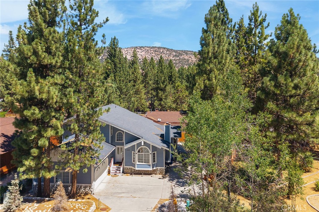 Spacious Big Bear Retreat -Ideal for Vacation ,second home ,or Airbnb Investment.
Welcome to our Mountain Escape in beautiful Big Bear ,CA !This expansive home comfortably accommodates up to 15 guests ,making it perfect retreat for large families ,group gateways or a high-performing Airbnb rental.
Step inside to soaring vaulted ceilings and an abundance of natural light that fills the open-concept living space.
Relax in the inviting living room by the fireplace ,or step out onto one of two private balconies -one off the kitchen and the other off the master bedroom suite -for fresh alpine air and peaceful views .
The gourmet kitchen features generous island countertops ,perfect for casual meals or entertaining , while multiple dining areas offer flexibility -gather around the formal dining table , pull up a stool at the breakfast bar or dine al fresco on the patio while enjoying a barbecue under the stars.
This home is a rare find, offering space ,comfort ,and charm of mountain living -ideal for creating lasting memories or generating rental income year-round.
The property is located at the end of Cul-De sac , which is an ideal feature for calm living and trafic free streets .