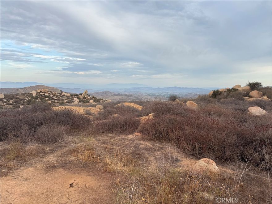 Take advantage of owning 18.96 acres of a quiet secluded hill top in the heart of Perris, California. Stunning Panoramic Lake Views of Lake Perris and Lake Elsinore. This expansive property offers a rare blend of natural beauty and development potential, making it ideal for your weekend getaway, private retreat, or investment project.

It has two pre-graded pads, ready for construction, simplifying your building process for a custom home, guest house, or additional structures. Conveniently situated to local amenities, highways (I-215, I-15 and CA-74), and nearby recreational opportunities at Lake Perris State Recreation Area. The Owner is willing to carry so don’t miss your chance to own a piece of Perris paradise with unmatched views and potential.

Contact us today for more details or to schedule a viewing of this remarkable 18.96-acre property!
