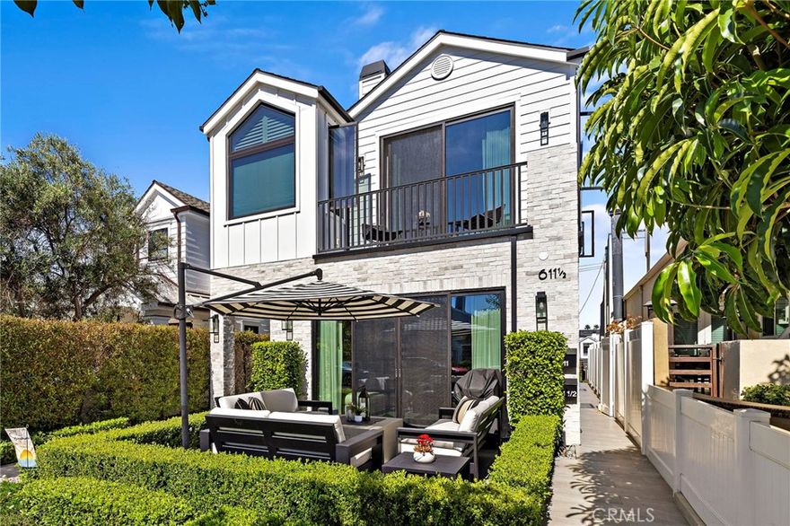 Located on one of the most elevated points of Jasmine Avenue in the heart of Corona del Mar’s Flower Streets, this newer-construction modern farmhouse back unit offers exceptional quality, refined design, and a rare level of versatility. Thoughtfully crafted to live larger than many front units, the residence features over 700 square feet of bonus space, transformed into three flexible rooms ideal for a home gym, office, media room, creative studio, or generous storage. A private elevator provides effortless access from the garage to the main living level, enhancing convenience and livability. The light-filled main level showcases an inviting living room with a stone fireplace and sliding glass panels that open to an outdoor terrace, creating a seamless connection for indoor/outdoor coastal living. The gourmet kitchen is appointed with premier appliances and finishes, including a Wolf range with custom hood, Sub-Zero refrigerator, farmhouse sink, spacious center island with seating, custom cabinetry, pantry, peninsula bar with wine refrigerator, and abundant storage. Wide-plank luxury flooring extends throughout the home, offering warmth and continuity. The elegant primary suite features automated window treatments and a spa-inspired bath with large shower, soaking tub, Brizo fixtures, and dual vanity. Secondary bedroom suites offer custom white-oak vanities and premium fixtures. Additional highlights include a finished garage, dedicated laundry, and thoughtful storage solutions. The expansive rooftop deck is the home’s crown jewel, capturing panoramic sunset views from its elevated vantage point. Complete with a built-in BBQ, speakers, and additional storage, this private outdoor retreat is ideal for entertaining or quiet relaxation.
Perfectly positioned just moments from the boutiques, cafés, dining, and beaches of CdM Village, this exceptional lease opportunity combines modern luxury, comfort, and an iconic coastal lifestyle. Offered at $7,700/month for a one-year term or as negotiated.