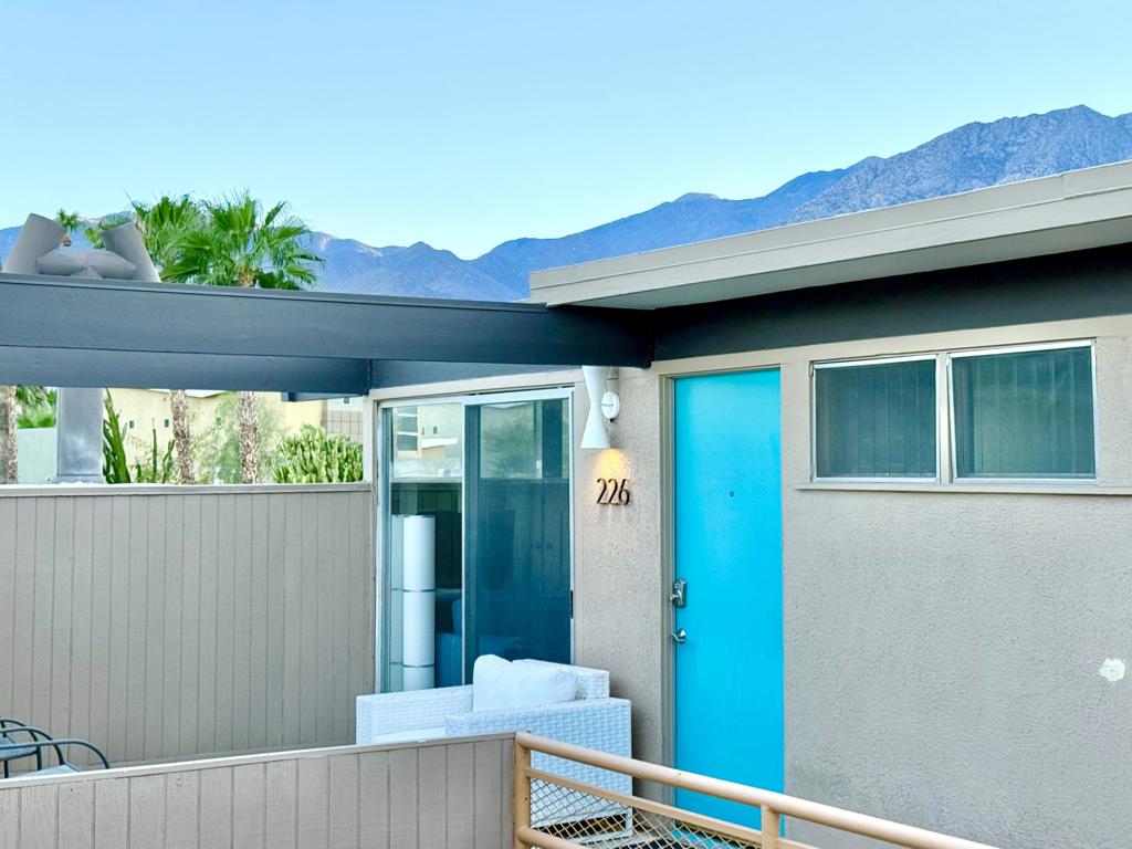 MID-CENTURY MODERN CONDO - STR-FRIENDLY - FEE LAND - Own a piece of Palm Springs history at the Ocotillo Lodge, an iconic mid-century community designed by William Krisel and Dan Palmer, and developed by the Alexander Company in 1956. This top-floor unit offers unobstructed mountain views through clerestory windows and has been fully renovated with new plumbing, electrical, HVAC, kitchen, bath, and flooring--ready for your personal touch.One of the few condo communities in Palm Springs that allows short-term rentals (subject to the city's regulations), and located on fee land, this property offers excellent income potential. Set in the sought-after Twin Palms neighborhood of South Palm Springs, it's just a short walk to dining, shopping, and hotels in a low-wind, highly walkable area.Enjoy resort-style amenities including the famous champagne cork-shaped pool, two hot tubs, fitness center, and clubhouse. The HOA covers all utilities, including electricity. As part of a Class 1 Historic District, the unit may also be eligible for Mills Act tax savings.Whether you're looking for a vacation home, income property, or both--this mid-century retreat delivers.