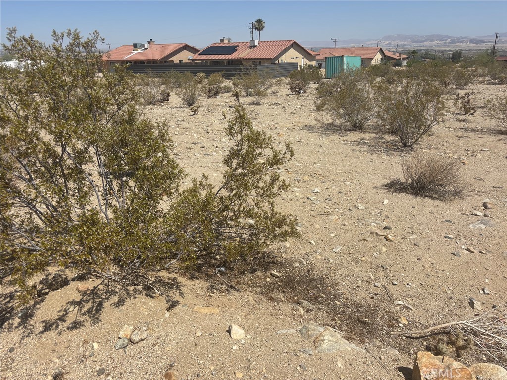This spacious vacant lot offers a unique chance to create a desert retreat in the heart of 29 Palms. Ideally located just minutes from the entrance of Joshua Tree National Park, the property provides unmatched access to hiking, climbing, stargazing, and all the natural beauty the area is known for.
With plenty of room to build, this lot is perfect for a primary residence, vacation getaway, or investment property.
The seller also offers buyers the option to have a manufactured home installed on the property. Visit www.Pecantreehomes.com to browse available models. Once a model is selected, the seller will handle the permits, transportation, and installation. Financing is available as part of a convenient land-home package.
Don’t miss the opportunity to own your own peaceful slice of the Mojave Desert—full of potential and ready for your vision.