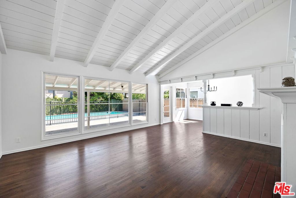 Set along a serene, treelined street in the coveted Hesby Oaks School district, this stunning midcentury ranch-style gem invites you to live the classic San Fernando Valley dream. Crafted by the celebrated architect William Mellenthin, this home showcases the very charm and durable craftsmanship he's famed for; from its open-beam ceilings and a dramatic two-sided brick hearth to its expansive walls of glass that bathe the home in radiant California sunshine. This home features freshly refinished oak floors in the living areas and brand-new flooring in the kitchen and baths with rich, lath-and-plaster walls that recall the home's authentic midcentury roots. The light-filled living room, graced by giant picture windows, offers a soothing view out to the covered patio that overlooks a private backyard oasis complete with a pool. Storage is plentiful throughout the home; with ample cabinetry, several closets, and a spacious laundry room. Recent enhancements include a brand-new water heater, upgraded toilets and bathroom fixtures, a fresh roof recoating, and updated light fixtures, all completed in the last few months. In addition, the plumbing system was overhauled just two years ago. Families will appreciate that this home is within the Hesby Oaks attendance zone, a top-performing K8 school ranked in the top 10% statewide. Everyone will appreciate the location: within a half-mile of countless shops, restaurants, and stores--including the Sherman Oaks Galleria--and within a mile of many more. All with swift connections to two major freeways that allow you to drive to LA's Westside in minutes and beyond.