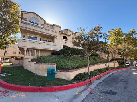 Photo of 19838 Sandpiper Place #65, Newhall, CA 91321 (MLS # IV26225407)
