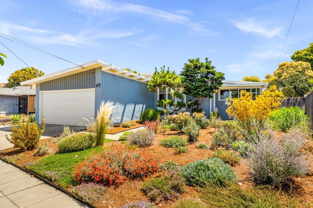 Welcome to 49 Gresel Street, a beautifully updated 3-bedroom, 2-bathroom home located in the Fairway Park community of Hayward. Situated on an oversized 7,360 sq ft lot, this property offers a spacious 1,252 sq ft interior and a thoughtfully landscaped exterior, ideal for relaxing, gardening, or ADU / expansion opportunities. Step inside to find a mid-century modern main living space with high ceilings featuring new floor-to-ceiling windows off the living room, a fully remodeled kitchen and bathrooms, hardwood floors, and a newer roof that adds peace of mind. Outside, the fully landscaped front yard creates instant curb appeal, while the oversized backyard is perfect for many uses, including a patio, grass, fruit trees, a dedicated garden area, and plenty of room to enjoy Californias year-round sunshine. A Tesla charging station adds modern convenience, and the home's location offers quick access to BART, the San Mateo Bridge, and major commute routes. Bordering Union City, this home is located in the highly rated New Haven Union City school district *buyer to verify.