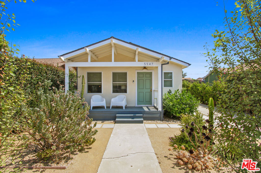 Welcome to 5547 Smiley Dr, a beautifully updated single-family home nestled in the vibrant heart of West Adams. Situated behind a privacy fence, you enter the front yard featuring native landscaping with lush greenery, a dwarf Meyer lemon tree, plus a porch, perfect for sipping lemonade and enjoying the breezes. This renovated 2bed + 2.5bath + office/3rd bedroom + separate family room is the perfect blend of modern charm and convenience. The light filled open living room/dining room feature recessed lights, engineered hardwood floors and vinyl windows. Kitchen updates include custom cabinets with Rejuvenation hardware, pendant lighting, butch block counters and stainless steel appliances, designed for effortless everyday living. Two generous sized bedrooms, one en suite with updates including double vanity and marble counter top. Hall bath has also been updated. There is also an extra room the could be used as an office, nursery or 3rd bedroom. The long driveway leads to a spacious and private manicured backyard, complete with jasmine vines, pomegranate and olive tree and hedges. The tranquil setting is perfect for alfresco dining, weekend gardening and relaxing. The backyard includes a garage conversion with 1/2 bath that is a versatile flex space which could function as a family room, remote workspace, creative studio, or gym. Room to park 4 cars in driveway, plus roomy shed in the back for additional storage. This home blends original character with thoughtful, design-forward upgrades including HVAC, vinyl windows, recessed lights, newer flooring, & drought tolerant landscaping. Close to neighborhood eats like Open Face Food Shop, Mizlala, Alta, Fleur et Sel, Highly Likely, Delicious Pizza, House Coffee Co, Chulita, Damn I Miss Paris, muso, Vicky's All Day, and opening soon Maydan Market. Short stroll to Westside Neighborhood Park, Whole Foods, the Metro, with close access to the fwy, downtown, as well as other neighborhood favorites like Persona, Divine Glow Esthetics, Antiqua, Hills & Heights Pilates, Good Mother, Pascals Printing, and the Blending Lab. This location truly has it all!