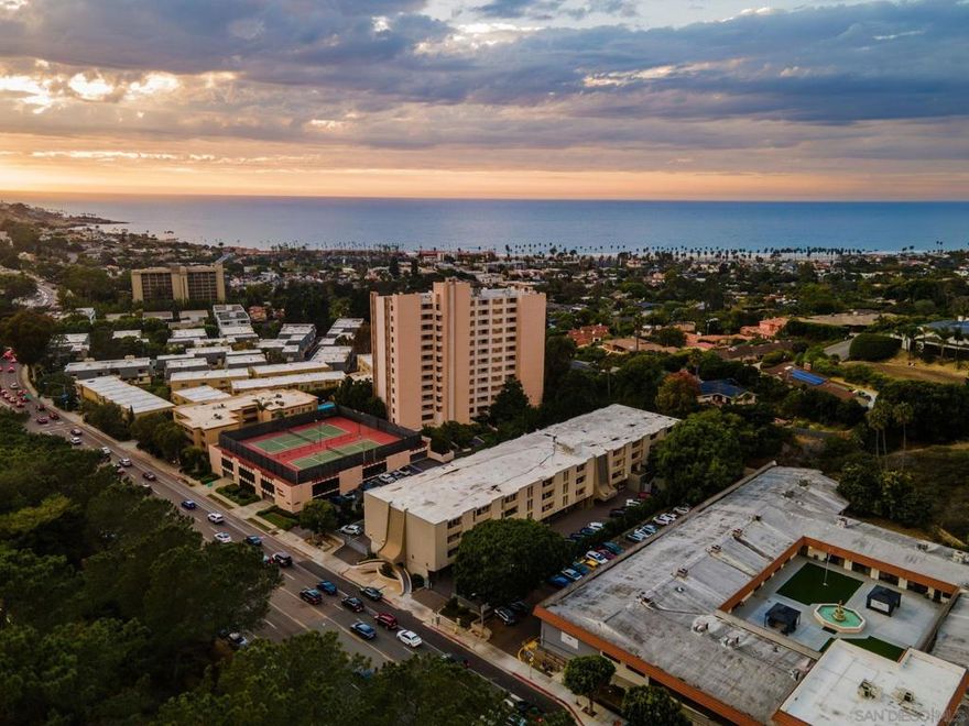 An exceptional top-floor 2-bedroom, 2-bath condo just a ~15 minute walk to the beach at the beautiful La Jolla Shores! This bright and airy home features an open floor plan with a spacious kitchen, dining, and living area that flow seamlessly together. A large lanai-style patio off the living room offers wonderful natural light and a sense of privacy—perfect for relaxing or entertaining. The primary suite is generously sized with an en-suite bathroom featuring an oversized vanity and a separate room for the tub/shower and toilet. The secondary bedroom is on the opposite side of the unit, offering ideal privacy for guests or a home office setup. The guest bathroom includes a tub/shower combo, great storage, and a nearby linen closet for extra convenience. This home is a fantastic opportunity for both end users and investors—ideal for long-term or short-term rentals. The HOA currently has no short-term rental restrictions, making it Airbnb-friendly. With the unbeatable location, you’re just steps from the beach, Kellogg Park, Scripps Pier, local restaurants, bars, and water activities like kayaking and snorkeling in the iconic La Jolla Shores. Recent upgrades include new light fixtures throughout (with added recessed lighting in the kitchen and living room), fresh interior paint, and new luxury vinyl plank flooring across the living, dining, kitchen, and bedroom areas. The unit also includes one assigned parking space, and the community offers a pool and shared laundry facilities. Don’t miss your chance to live—or invest—in your own slice of the La Jolla beach lifestyle!