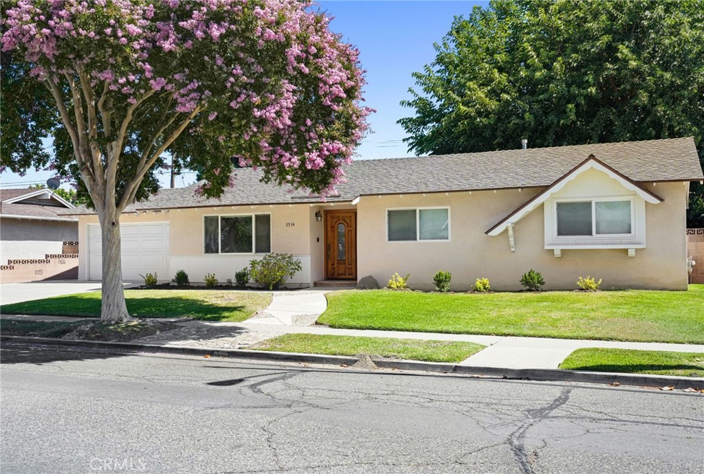 Located in the heart of a quiet, tree-lined street in a well-kept neighborhood, 3534 Hearst Dr is a beautifully maintained single-story home that blends classic character with modern updates. The traditional floor plan features clearly defined spaces for living, dining, and entertaining, all filled with natural light and a welcoming atmosphere.
The home offers three comfortable bedrooms and two bathrooms, both recently updated and exceptionally clean. The kitchen is well-appointed with granite countertops, a matching backsplash, stainless steel appliances, and plenty of cabinet space—perfect for everyday use or hosting. Laminate flooring runs throughout the home, complemented by double-pane windows that enhance energy efficiency and comfort.
Smart features include Alexa-controlled lighting in the living room, kitchen, and hallway, as well as a Ring security system for added convenience. The primary suite provides a private retreat with its own bathroom and views of the serene backyard.
Additional highlights include a newer HVAC system and the inclusion of a washer, dryer, and refrigerator. The spacious backyard offers mature trees, colorful landscaping, and a shady patio ideal for relaxing or entertaining.
The attached two-car garage features built-in shelving for storage, and the wide driveway offers extra parking. With thoughtful upgrades, a functional layout, and a prime location, this home is ready for you to move in and enjoy. Tenant is responsible for all utilities. Gardening service is included.
