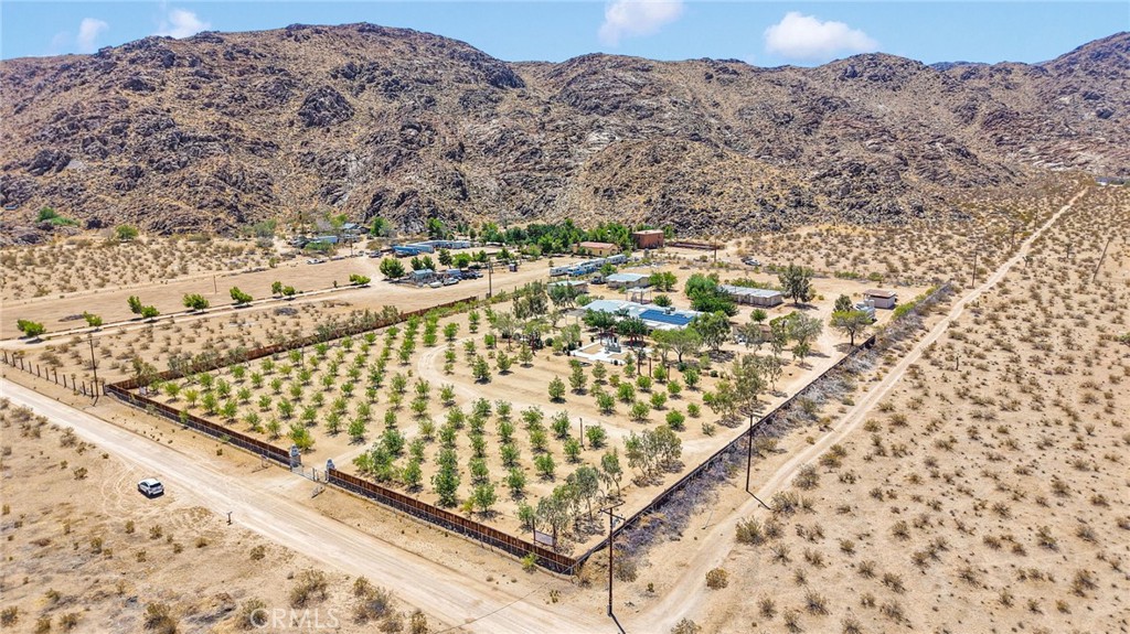 Beautiful Multi-Income Property with Endless Potential! 9 TOTAL UNITS!
Welcome to this unique 5-acre oasis offering a rare blend of tranquility, functionality, and incredible income-generating opportunities. Whether you're looking for a serene homestead, an investment property, or a bit of both — this property has it all.
Agricultural Opportunity! Featuring 100 healthy, productive jujube trees, this land is ready for agricultural ventures or farm-to-table business ideas. With established trees already thriving, you can step right into a profitable operation.
Spacious Main Residence! The main home is a well-maintained 4 bed, 4 bath manufactured home with a Sauna and quality additions including:
• A full garage
• A dedicated gym space
• A massive meditation area that can be repurposed to suit your lifestyle — yoga studio, art space, office, or entertainment room.
Income-Generating Living Quarters! Four additional outbuildings house 8 private studio units, each complete with a full kitchen and bathroom — ideal for short or long-term rentals, guest accommodations, or retreat hosting.
Reliable Water & Energy Systems
• Supplied by a well-maintained private well (with a recently replaced submersible pump).
• Solar panels reduce utility costs and support sustainable living.
Outdoor Features
• Entire 5 acres fully fenced for privacy and security
• A peaceful koi fish pond adds charm and calm to the landscape
Priced to Sell — Motivated Sellers! This one-of-a-kind property blends functionality, comfort, and income potential like no other. Whether you're an investor, entrepreneur, or someone seeking a peaceful retreat with room to grow — this is your opportunity.
Come tour today and fall in love with everything this incredible property has to offer.