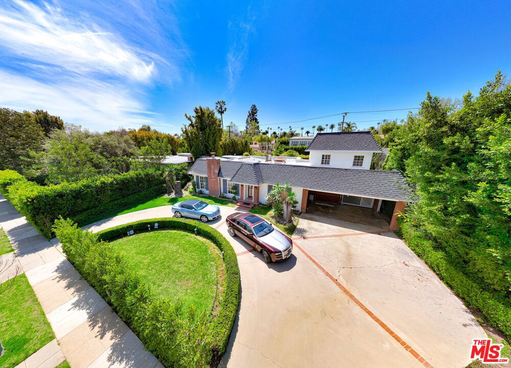 FAMOUSLY LOCATED IN THE BEVERLY HILLS FLAT W/ EQUALLY FAMOUS ZIPCODE 90210. THIS INCREDIBLE DREAM HOME IN THE HEART OF THE BEVERLY HILLS HAS IT ALL !!. THIS TRADITIONAL HOME IS A MUST SEE: FEATURE CENTER HALL FLOOR PLAN W/ 6BR & 6BA ON TWO SEPARATE PROPERTIES ON AN OVER-SIZE LOT NEARLY 14,000 SF; MAIN-HOUSE HAS 3 BEDROOMS, 3 BATHROOMS DOWNSTAIRS AND 2 EN-SUITE BEDROOMS UPSTAIRS. THE ESTATE FEATURES A SPACIOUS LIVING ROOM W/ GRAND FIREPLACE, FORMAL DINING ROOM W/ GORGEOU CHANDELIER, SPACIOUS KITCHEN, COZY CARD ROOM / BAR ROOM AND LARGE FAMILY RM LEADING TO A BEAUTIFULLY & PRIVATE LANDSCAPED VERDANT BACKYARD; THIS HOME WOULD NOT BE COMPLETE WITHOUT A BEAUTIFULLY DESIGNED SHAPE SWIMMING POOL, BARBECUE/OUTDOOR DINING AREA; THE CHARMING & SEPARATE POOL/GUEST HOUSE FEATURES EXPOSED-BEAM & VALTED CEILING AND AN INVITING STONE-FACE FIRE-PLACE WITH ONE BATH THAT WOULD TRANSPORT YOU AND GIVE YOU A FEEL OF WOODEN CABIN; MAIN HOUSE HAS RARE PEG & GROOVE HARDWOOD FLOORS, CARPET, AND TILE FLOORING THROUGHOUT; THIS ESTATE FEATURES A GRAND CIRCULAR DRIVEWAY INCLUDING PARKING FOR 7+ CARS; IT IS PRACTICALLY STONE-THOW AWAY FROM THE DESIRABLE HAWTHORNE ELEMENTARY SCHOOL. PRIME LOCATION WITH PROXIMITY TO THE GOLDEN TRIANGLE FEATURING WORLD CLASS DINING; BRAND NAMES BOUTIQUES, BEVERLY HILLS CITY HALL & CENTRAL LIBRARY & POLICE STATION; FAMOUS BEVERLY HILLS LANDMARKS, FAME SHOPS, RENOUNCED FINANCIAL INSTITUTIONS, AMONG THE BEST SCHOOL DISTRICT IN THE COUNTRY. AND MUCH MORE..! MOST UNIQUELY AND TRULLY ONE OF KIND, THIS WAS THE FORMER RESIDENCE OF "MARY MARTIN" - THE FAMOUS ACTRESS, SINGER, AND STAR OF THE MOTION PICTURE "PETER PAN". WELCOME YOU HOME TO THIS CHARMING ESTATE !!! WON'T LAST !! ** GUEST HOUSE IS NON-PERMIT & ITS SF IS INCLUDED IN TOTAL HOUSE SF **