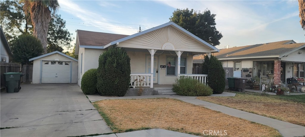 Investor special or great starter home!! Bathroom fully remodeled and newer kitchen cabinets. This home has a detached garage and is sitting on a large lot with alley access. Washer/Dryer, stove, and refrigerator included in sale.