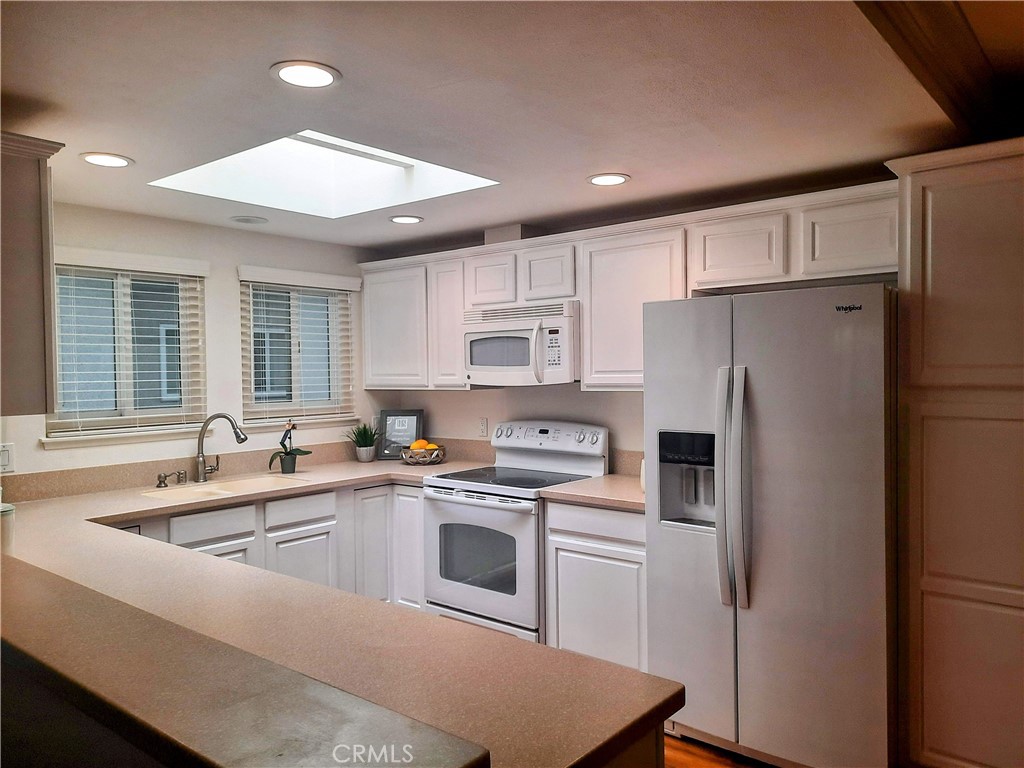Beautifully remodeled 2-bedroom, 2-bathroom Casa Linda model located in the highly desirable NOB HILL area of Laguna Woods Village. This upstairs no one above unit offers EASY ACCESS with NO STEPS from the carport, making it both convenient and accessible.
Step inside to a bright, OPEN-CONCEPT living space featuring dual pane windows, crown molding, and a REMODELED KITCHEN with a skylight, recessed lighting, and plenty of counter space—perfect for entertaining. The ENCLOSED BALCONY provides additional living space and includes a storage closet for added convenience.
Enjoy the comfort of an IN-UNIT WASHER & DRYER, and relax in the spacious primary suite with a beautifully updated en-suite bathroom. The guest bathroom has also been remodeled and features a shower/tub combo and a skylight for natural light.
Don’t miss this move-in-ready home in one of Orange County’s premier 55+ communities with top-notch amenities including golf, pools, fitness centers, clubs, and more!