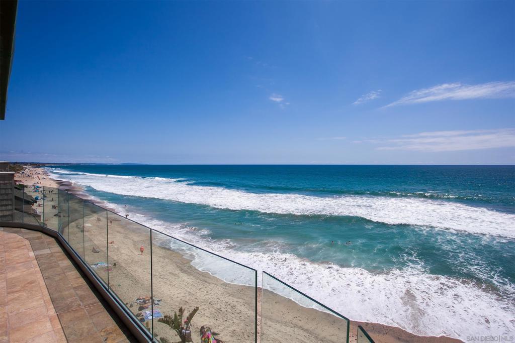 Premier Oceanfront Penthouse! Experience luxury living in this extraordinary beachfront residence on Ocean Street, directly on the sand in Carlsbad. The residence is single level spanning the entire top floor of the south tower, boasting unobstructed white water views that offer a coastal panorama as far as the eye can see. A private deck/balcony embracing the oceanfront is accessible from the main living area and the primary suite. Perfectly positioned within Carlsbad Village, this residence is just moments to quaint boutiques, an array of dining, and the coastal charm that defines this walkable seaside community. A spectacular opportunity to own a prime beachfront in Carlsbad. In addition to the exceptional living spaces of this residence, the property further offers the added value of a separate and spacious beachfront "storage" (approx 200-250sf of addl space) that has been charmingly upgraded into a beach room complete with full ocean views. Located on the beach level and accessible via community elevator or courtyard staircase, this space allows the storage of all your beach essentials while providing direct access to the beach side common areas. Additional Features of Interest: Beachfront balcony (approx 45') lined with glass wind walls the entire span | Professional interior design | Custom wood beamed vaulted ceilings with complimented paddle fans | Spacious bonus/family room with adjoining Ocean St balcony | Courtyard facing balcony with separate full bath complimenting the north guest suite | Stone gas fireplaces in the living room as well as the primary suite | Gourmet kitchen - Full Ocean View: Granite counters | Viking Professional range and hood Viking microwave | Viking dishwasher | Monogram compactor Sub Zero refrigerator | Wine storage | Stone flooring throughout core living area | Marble master counters | Laundry room - LG appliances | Tankless hot water | Air conditioning | Attached garage plus dedicated parking space within the gated parking structure | Community Features: Approx 110' Frontage Lot | Substantial concrete storm wall - center staircase with direct gate access to beach | Private gated front courtyard common areas | Guest parking at Ocean St. | Common area elevator | Monitored fire sprinkler system