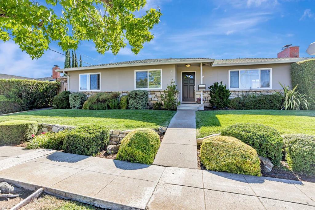 Beautiful home on a large corner lot in the desirable Union School District, offering plenty of space to extend or add an ADU. This 3-bedroom plus BONUS ROOM residence features newly remodeled bathrooms and gleaming hardwood floors throughout. The brand-new spa-like primary bath is a serene retreat, while several bedrooms offer new closets. Recent updates include a new roof plus new appliances in the kitchen and laundry for modern convenience. The elegant formal living room boasts custom paint, glass doors, and a cozy fireplace, while the spacious family/dining/kitchen area offers its own custom fireplaceperfect for gatherings. Step outside to a huge backyard with lush grass, a large pergola-covered patio, and beautiful solar-powered night lighting that highlights the gardens. Additional features include a large storage room, extra off-street parking, and abundant space for outdoor entertaining. Located within award-winning Oster Elementary, Dartmouth Middle, and Branham High boundaries. This is truly an awesome place to call home!