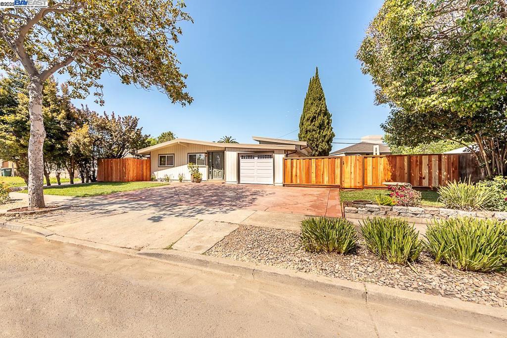 A stunning contemporary home that has been tastefully remodeled with the finest, high-end finishes. Showcasing open-concept living with the perfect blend of modern yet classic design. Walk into a spacious living room immersed in natural light. The living space flows into a gorgeous open kitchen and dining area. The brand new kitchen includes a large island with breakfast bar seating and new stainless steel appliances with a gas range. Spacious bedrooms and fully remodeled bathrooms exuding the utmost style and sophistication. Generous front, back and side yards with the possibilities of expansion or adding an ADU. An enchanting park-like yard with paved walkways, custom built fire pit, a private pergola and lush manicured lawns. The outdoor plant life is vast and varied, with trees, flowers and grasses illustrated in exquisite detail. Indoor outdoor living all blended together for a home that whisks you away with magic in every corner. Prime location with easy access to freeways, public transportation, restaurants and major employers of the Bay Area.