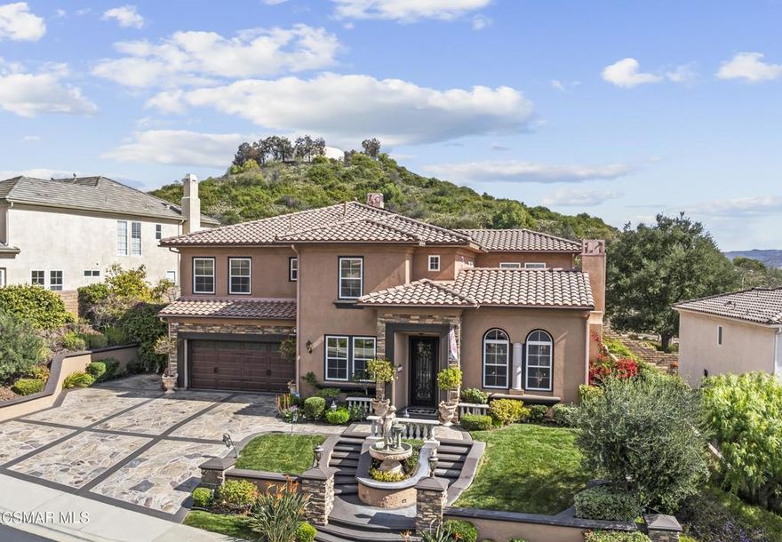 Freshly painted interior move-in ready with a $126,000 price reduction. From the moment you enter this prestigious gated community of Serenata / Trieste tract. and step through a custom iron front door into the dramatic foyer. You will be dazzled by the detailed craftmanship with no expenses spared. You are greeted with 2 formal sitting areas, one with a built-in wet bar for hosting the best parties. The other, a living room has a cozy fireplace surround.  The arched hallway opens up to a vaulted ceiling with an adjacent walk-in temperature-controlled wine cellar, powder bathroom for guests, and a view of a private water featured courtyard. As you flow into the formal dining room, perfect setting for your special events it's as elegant as it gets. A large butler's pantry connects into the chef's gourmet kitchen which features a massive, hooded center island, breakfast bar with all stainless-steel high-end appliances, granite countertops and a large eat-in area. The family room is an open concept where you can entertain your guest and gather around the fireplace. In front of a built-in theater entertainment center with 2 large adjoining rooms. The laundry room has a countertop and plenty of cabinets for storage. From there you can walk out into the two-car finished garage with built in cabinetry and a third car tandem space 123 Sq Ft ''not included'' in total square footage of home This has been converted into office/maid quarters. The second level features a large landing with 5 spacious bedrooms, including a magnificent primary suite breathtaking view of the Regan Library across rolling hills. The ensuite bathroom includes a jacuzzi soak tub and step-in shower with 2 resting benches. There are also His and Hers walk-in cedar lined closets with custom cabinet units. The back yard is breathtaking, stunning and perfect for entertaining.  It has all to offer including an auxiliary solar heated pool/spa, built- in barbeque, fire pit, Pizza oven. Koi pond with waterfall, a cabana with fans misters, heat lamps, and lastly, a retractable awning for outside dinning and shade. That's right it has it all! This home offers approximately 4,777 square feet. five bedrooms, five bathrooms and the luxurious open floor plan feature high 9-12-foot ceilings with crown moldings. There is also custom millwork throughout including solid interior doors, custom cabinetry, window coverings, natural stone, marble, wood flooring throughout and extensive hard scape. With immediate and future savings in mind, there's an owned Solar System with back up battery This is magnificent well-maintained home with low HOA dues, easy access to freeways. convenient shopping, beautiful parks and walking trails.