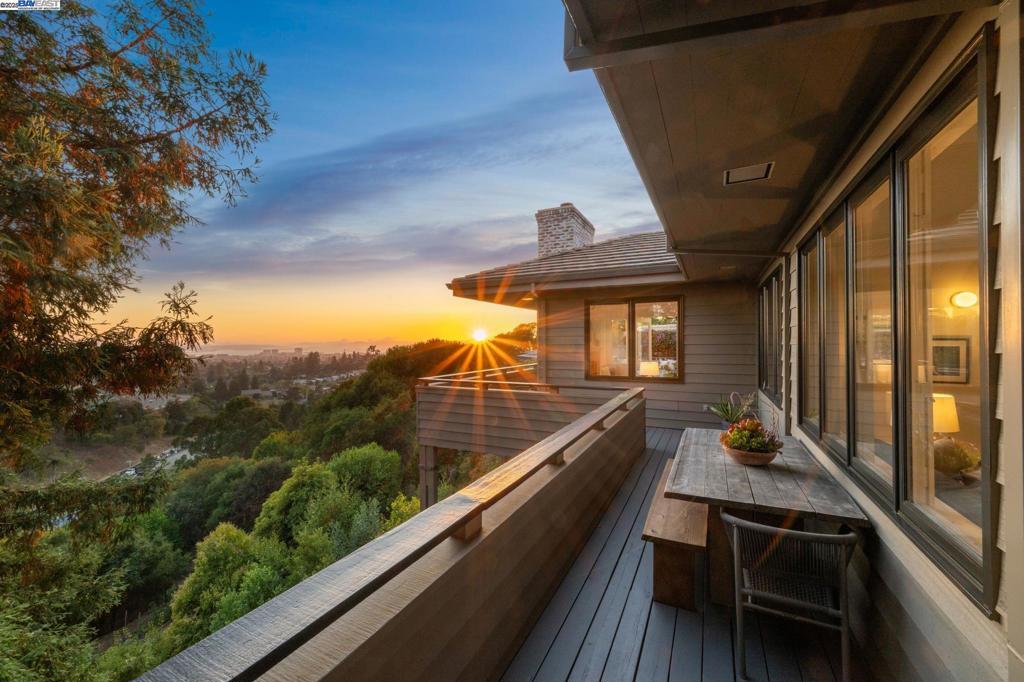 Up a private wooded way on distinguished Roble Road, in an exclusive enclave between the Claremont and Rockridge neighborhoods, this elegant 4+BD/4.5BA contemporary home is a rare find with a full-service 1BD/1BA in-law unit, stunning San Francisco Bay views, three en-suite bedrooms, and multiple decks for indoor/outdoor living. Bay Bridge and Golden Gate views are the backdrop to the 3659 SQFT home’s luxurious living. Entertain or relax with family and friends in the grand living room with walls of windows, a coffered ceiling, built-in shelves, a powder room, and deck access. Gorgeous hardwood floors span into the sunny dining room and sitting room with French doors onto a deck. The kitchen is spacious with garden views, nearby laundry room, flexible area for dining and an office with built-ins. The primary suite features a roomy walk-in closet, big full bath, and access to the decks. A secondary bedroom enjoys bay views, a full bath, and built-ins and a private tertiary bedroom also has its own ensuite. The large, full service apartment (with laundry) features French doors to a deck and the backyard. A 2-car garage, EV hookup & nearby Rockridge BART make for an easy commute. Down the road enjoy the East Bay’s world-class amenities: dining, the arts, and the beautiful outdoors.