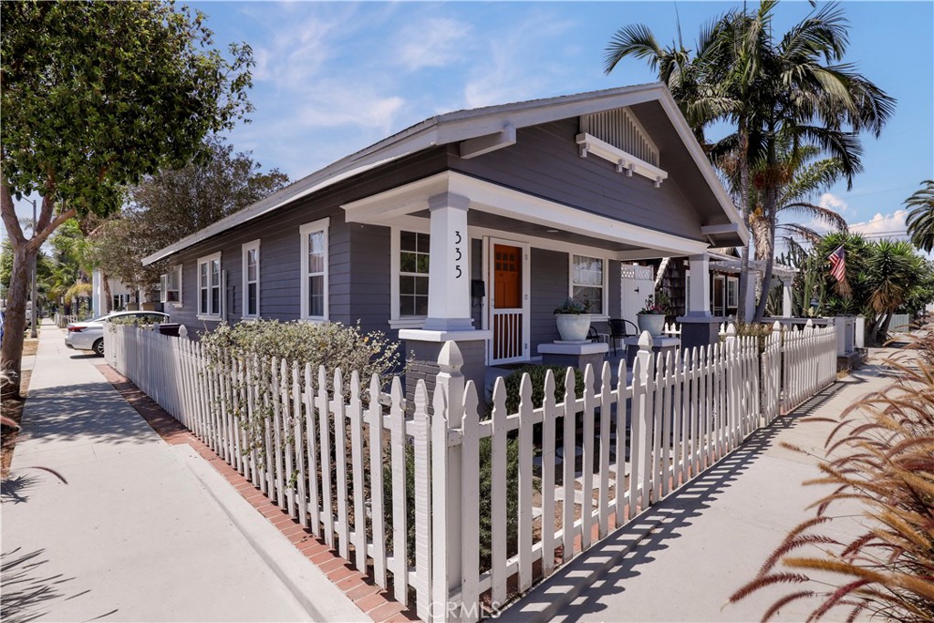 Appraised at $850,000 in July 2025! Proudly introducing this delightful 2-bedroom, 2-bath California Bungalow, perfectly situated on a desirable corner lot in the heart of Alamitos Beach area of Long Beach. Built in 1918, this 792 sq ft home blends vintage charm with thoughtful modern updates. Enter inside to an open floor concept enhanced by beautiful bamboo flooring and a ductless mini-split system for year-round comfort. Each bedroom features its own en-suite bathroom—one of which has been updated with permits that adds a fresh, contemporary touch to this classic residence. Outside, enjoy a low-maintenance, drought-tolerant native landscape in the side yard and a picket-fenced front yard perfect for relaxing on the porch or entertaining guests. The one-car garage offers excellent storage options and includes a brand-new washer and dryer set. Located just moments from Bixby Park, Alamitos Beach, The Pike, Long Beach Pier, Belmont Shore, and vibrant 2nd Street—this home offers unbeatable access to cafes, shops, dining, and outdoor recreation. Don't miss your chance to own a piece of Long Beach history with modern conveniences and a prime coastal lifestyle!